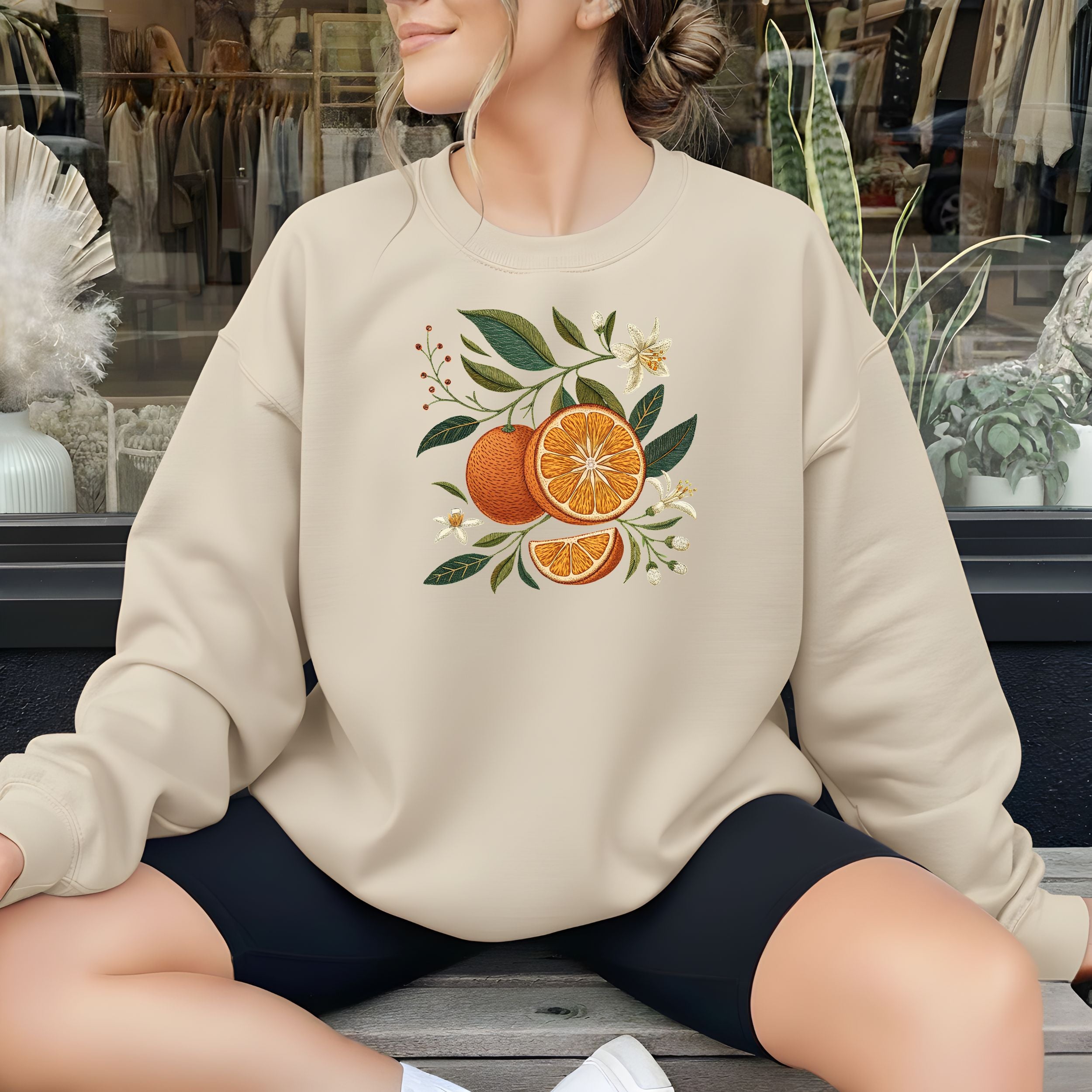 Cozy Beige Sweatshirt with Vibrant Orange Print Design