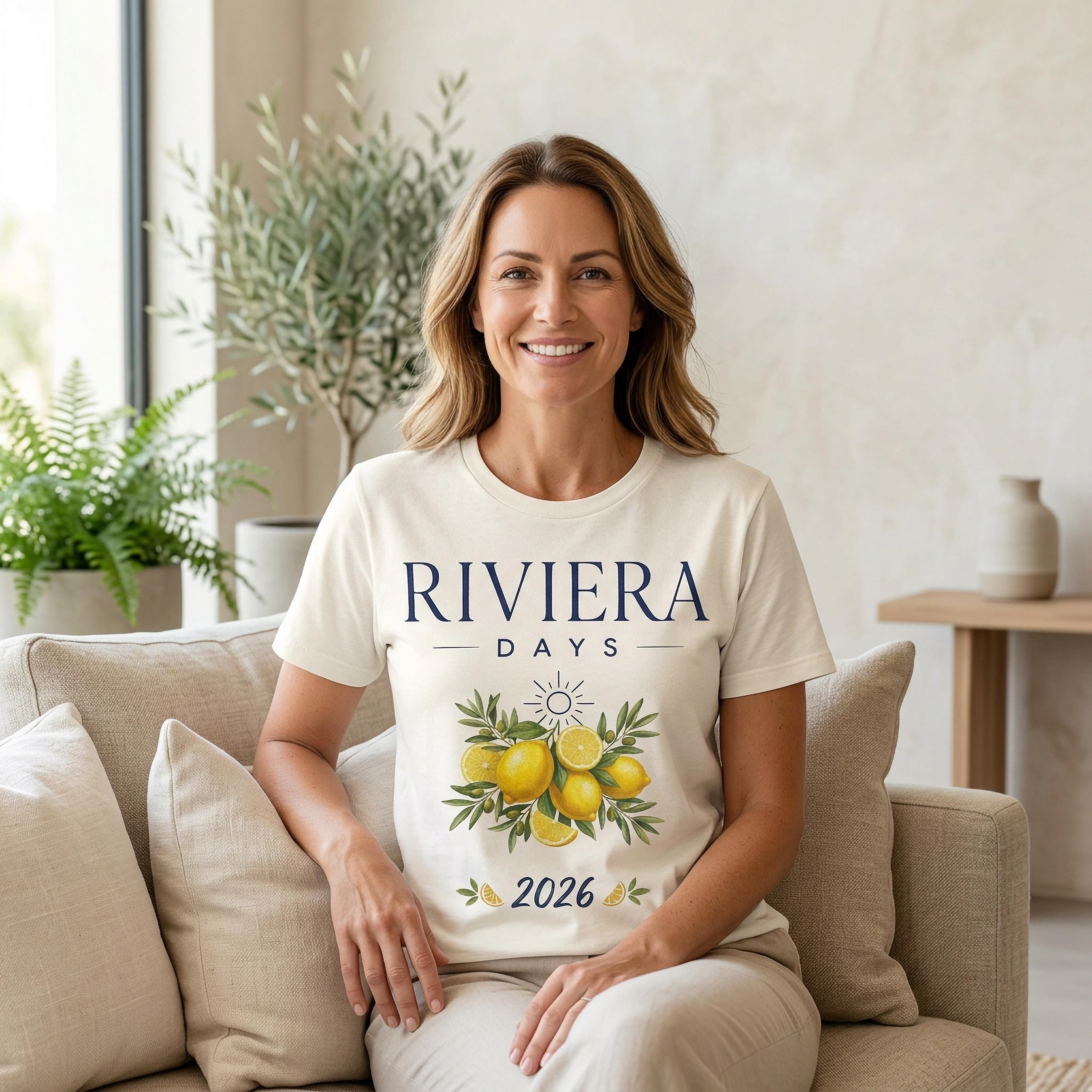 Woman wearing a cream t-shirt with lemons and "Riviera Days 2026" text.