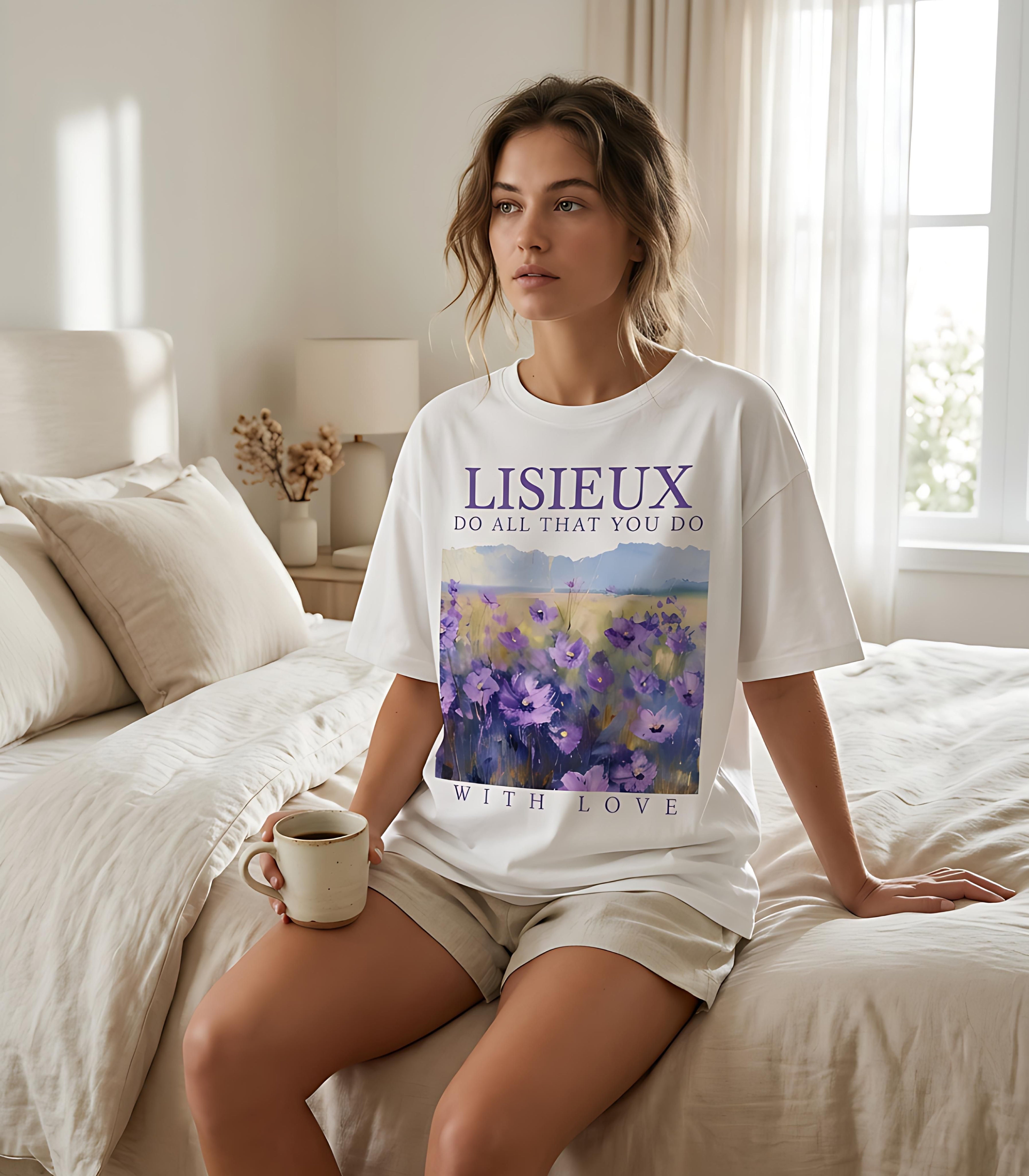 White t-shirt with "LISIEUX DO ALL THAT YOU DO WITH LOVE" and purple floral art.