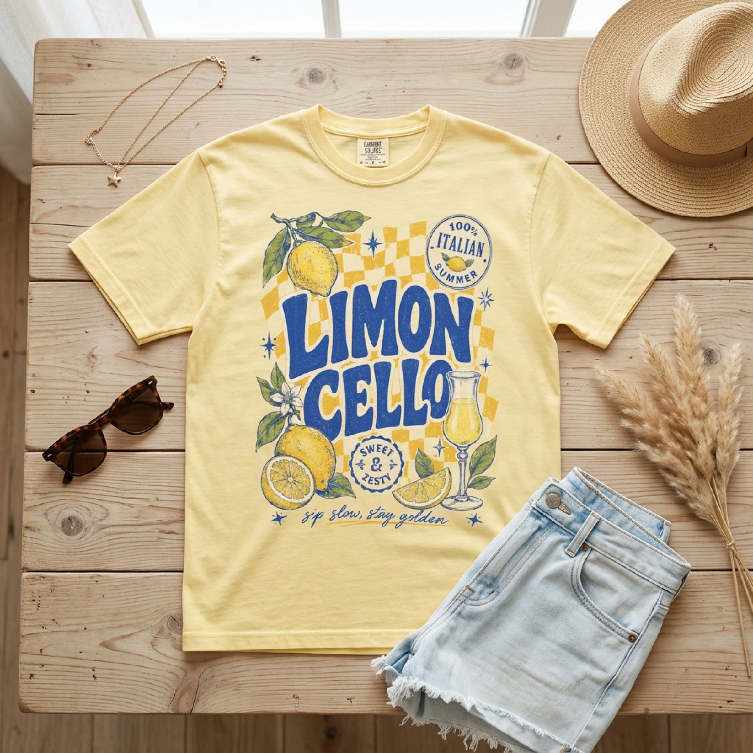 Yellow t-shirt with "Limon Cello" graphic, lemons, and text.