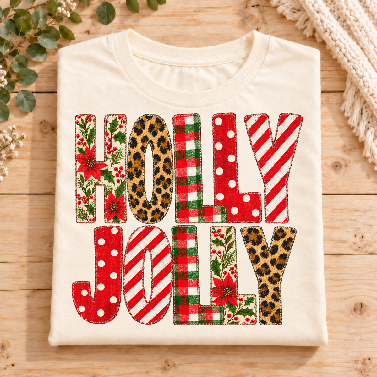 Cream t-shirt with "HOLLY JOLLY" text in patterned letters.
