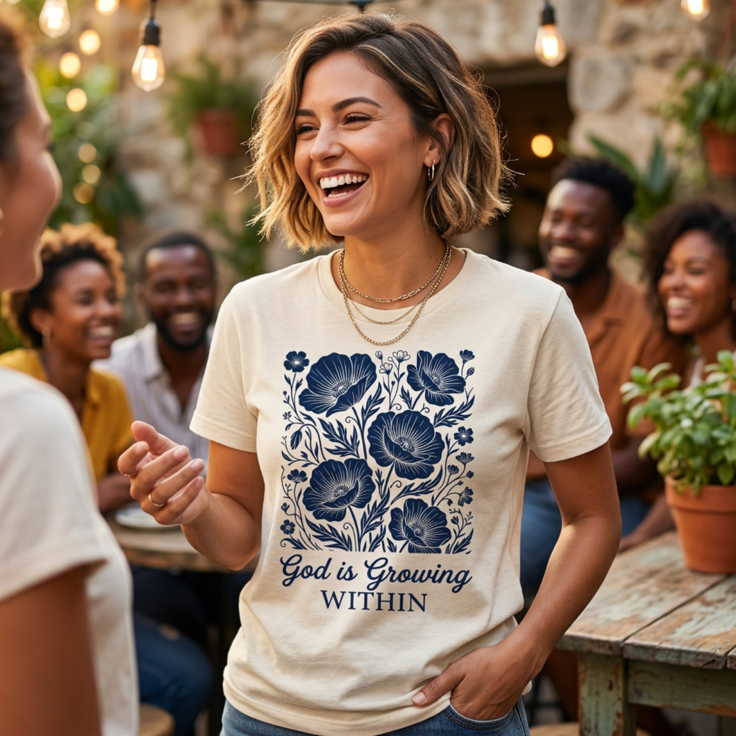 Cream t-shirt with dark blue floral design and text "God is Growing Within".