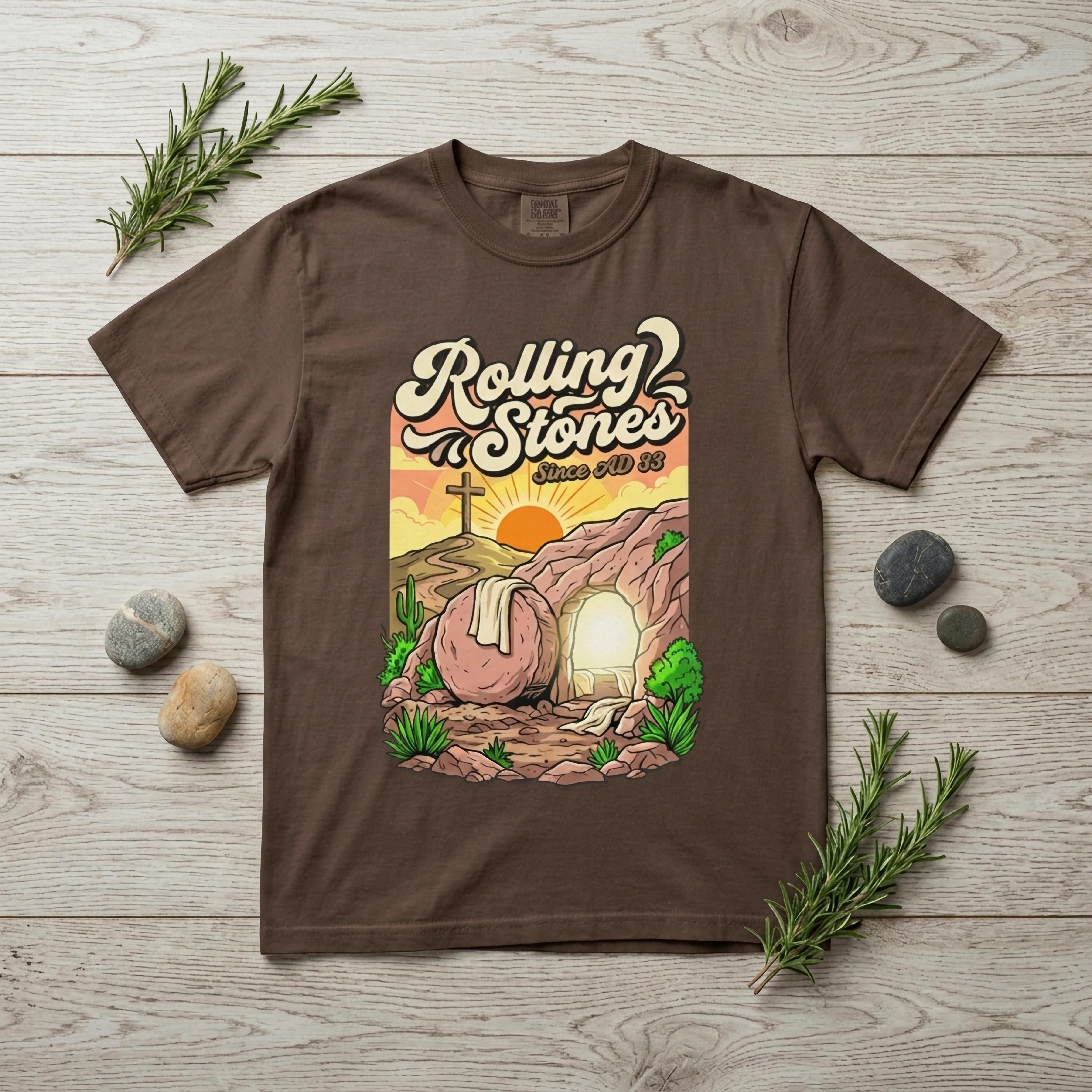 Brown t-shirt with "Rolling Since AD 33" and a tomb scene at sunrise.