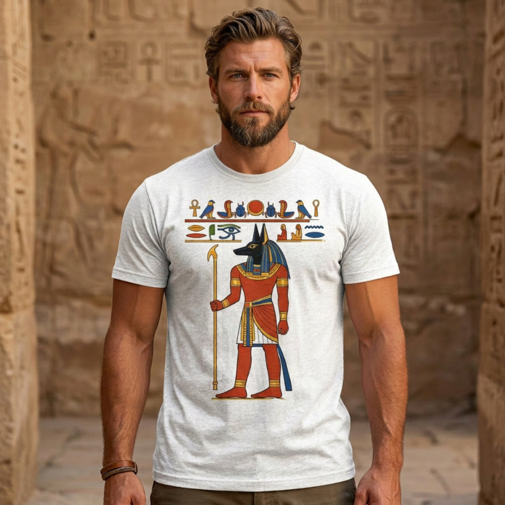 Man wearing a grey t-shirt with Egyptian Anubis god graphic.