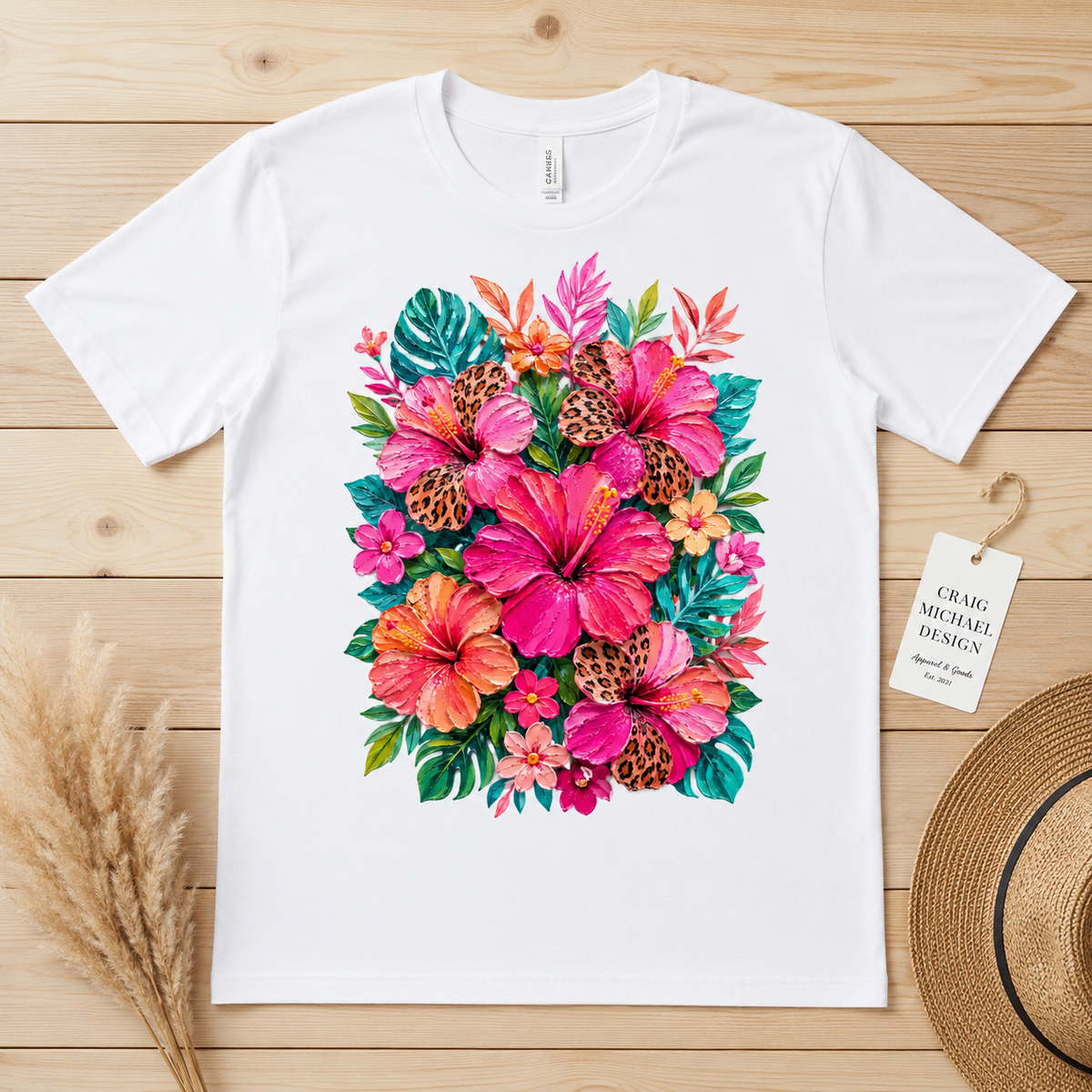 White t-shirt with vibrant hibiscus flower and leopard print design.