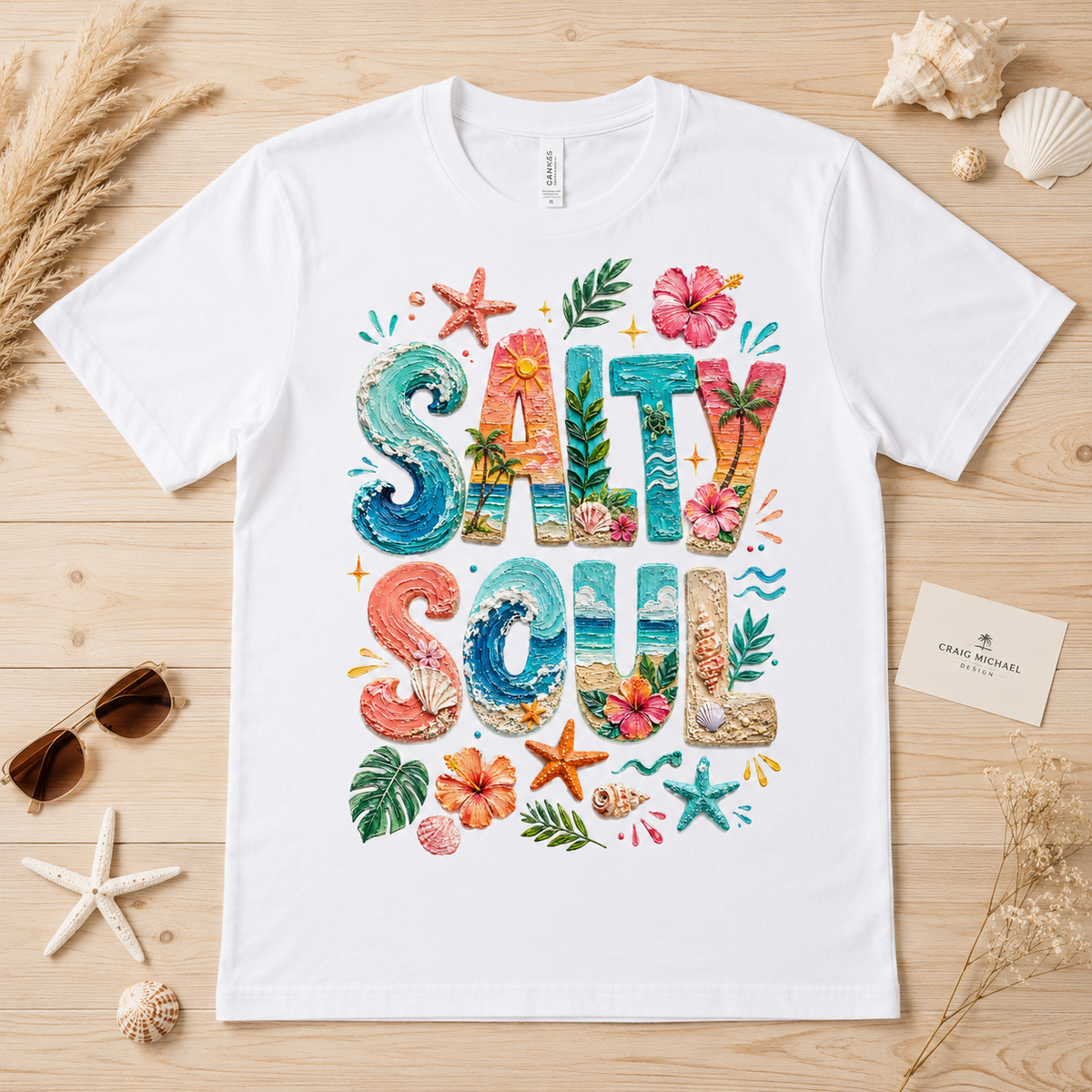 White t-shirt with "Salty Soul" text in colorful beach-themed lettering.