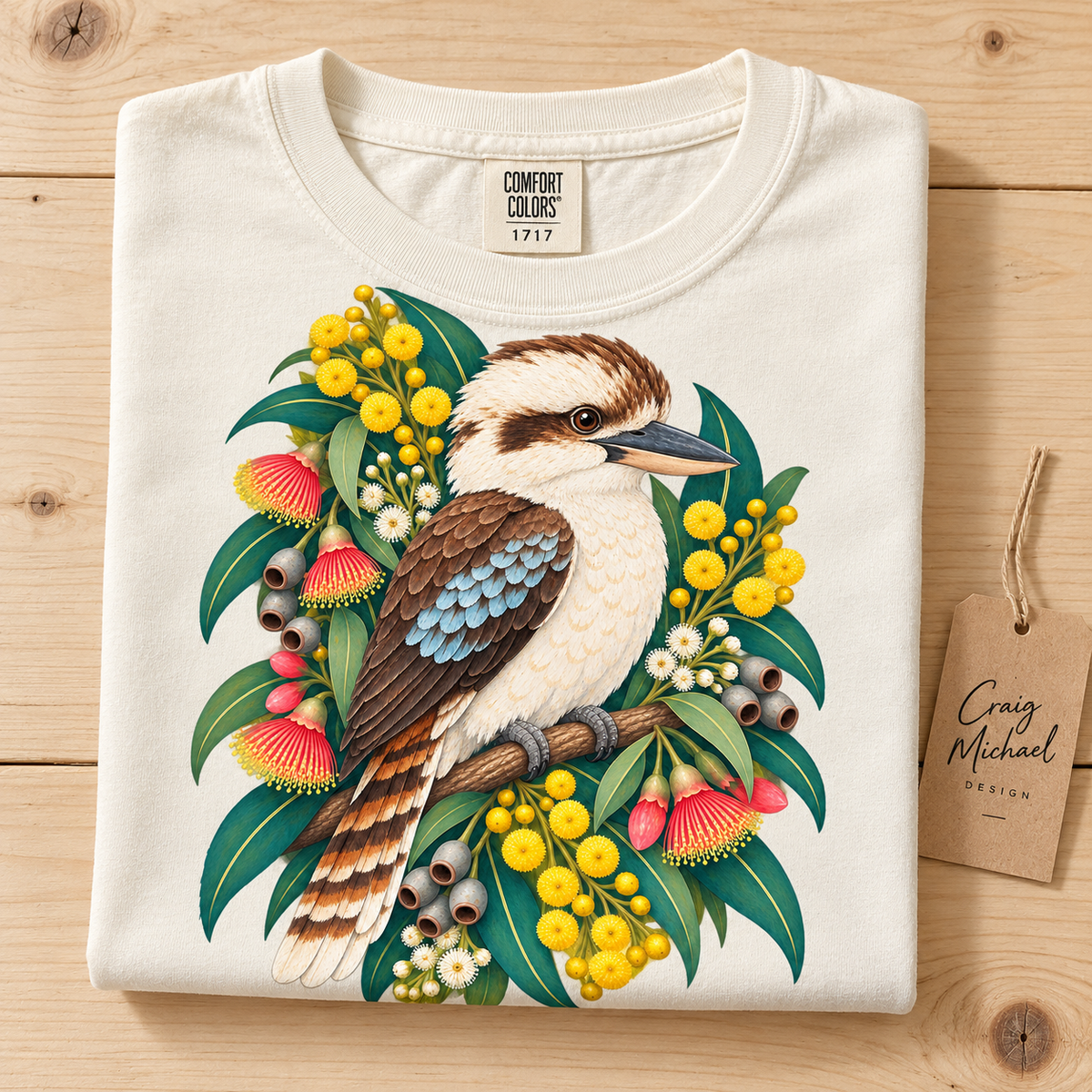 Kookaburra perched on a branch with Australian native flowers and foliage.