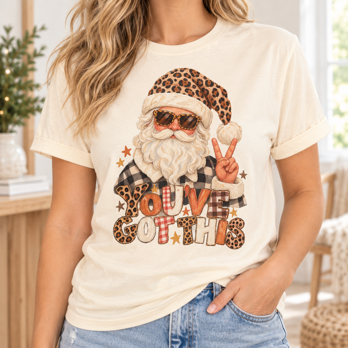 Santa with sunglasses and leopard hat gives peace sign with "YOU'VE GOT THIS" text.