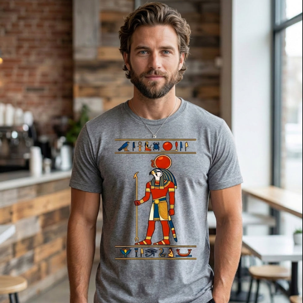 Man wearing grey t-shirt with Egyptian deity Ra depicted in colorful hieroglyphics.