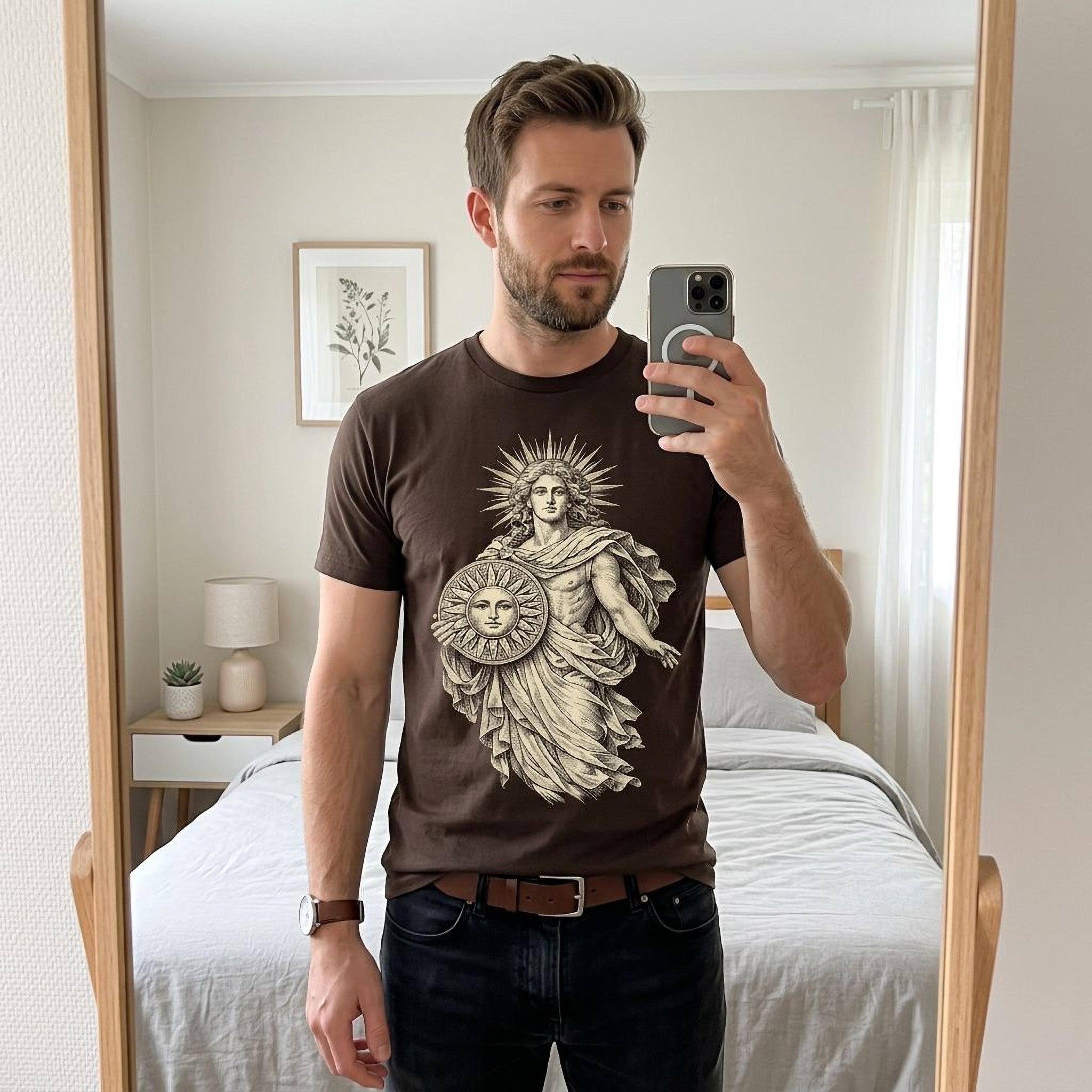 Man in brown t-shirt with Apollo graphic, reflected in a mirror.