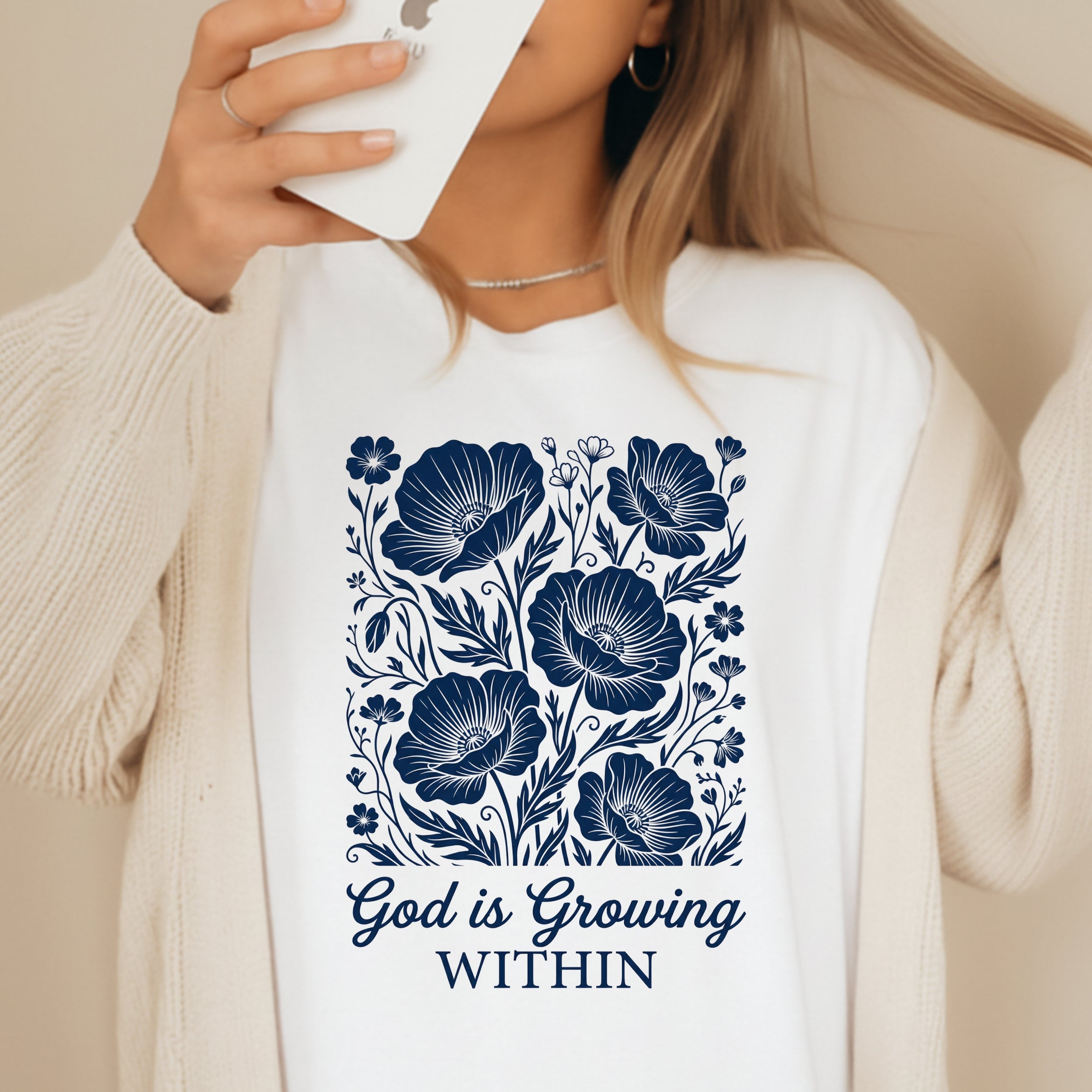 White t-shirt with navy blue floral design and text "God is Growing WITHIN".