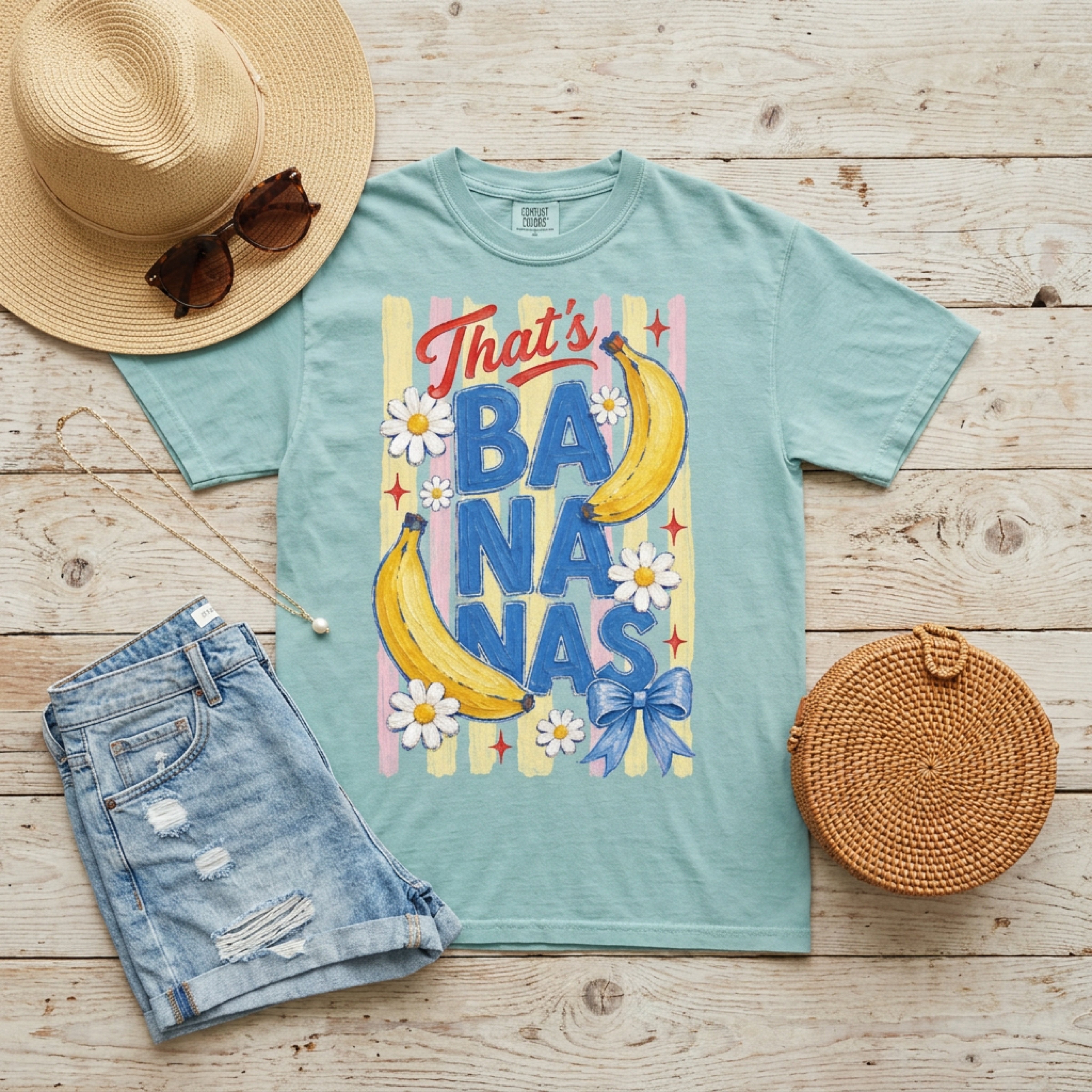 Blue t-shirt with "That's Bananas" graphic and banana illustrations.