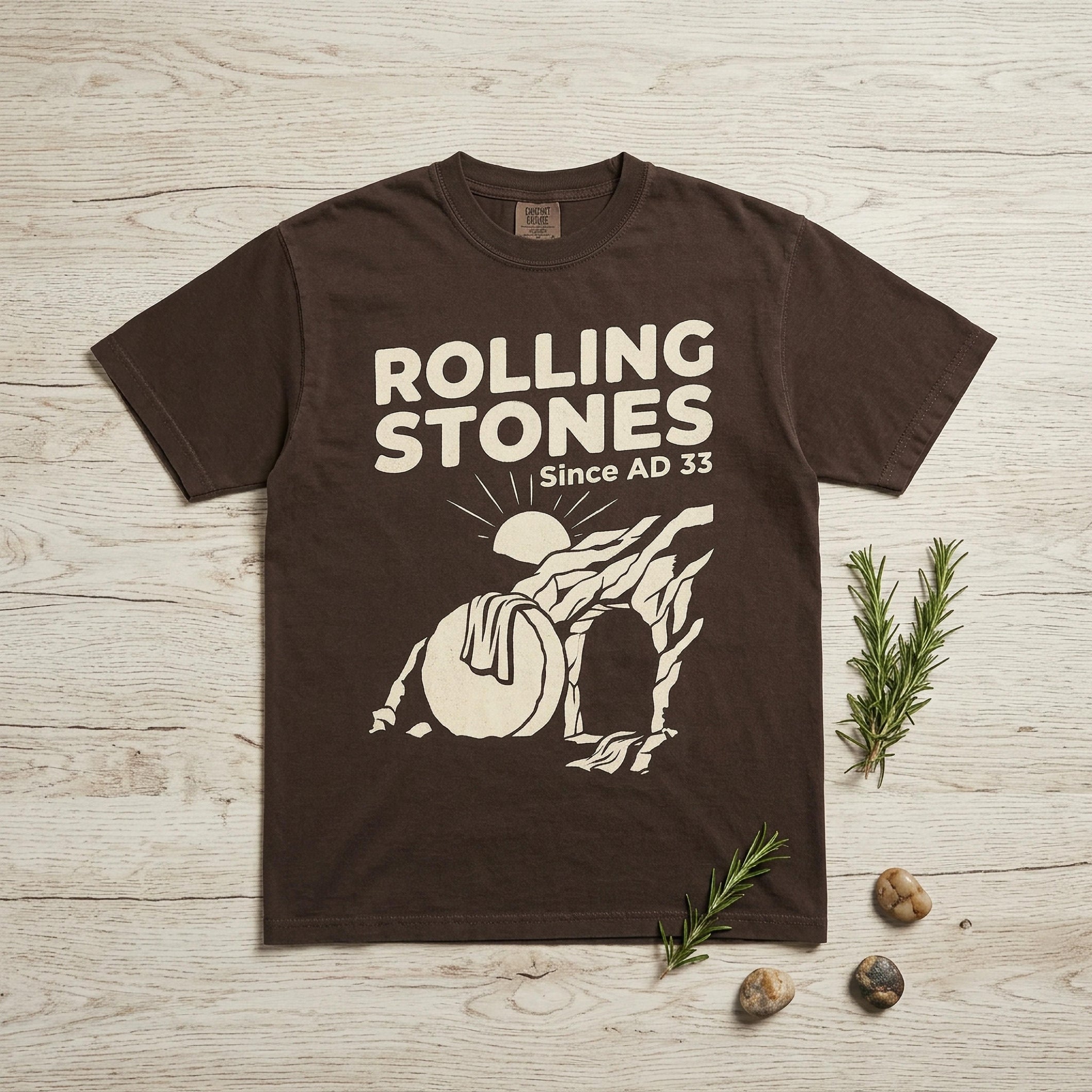 Brown t-shirt with "Rolling Stones Since AD 33" and stone tomb graphic.