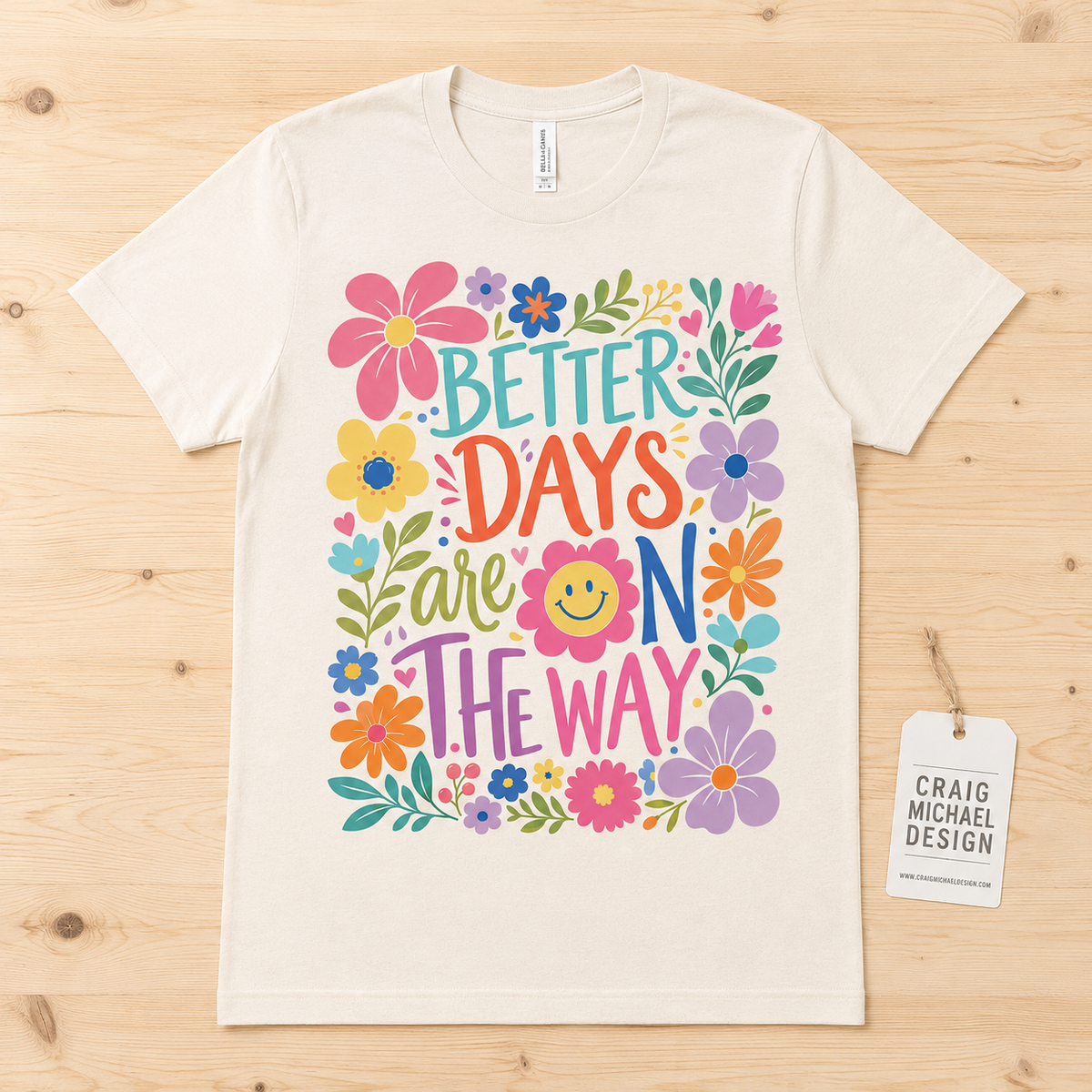 Cream t-shirt with colorful flowers and "Better Days Are On The Way" text.
