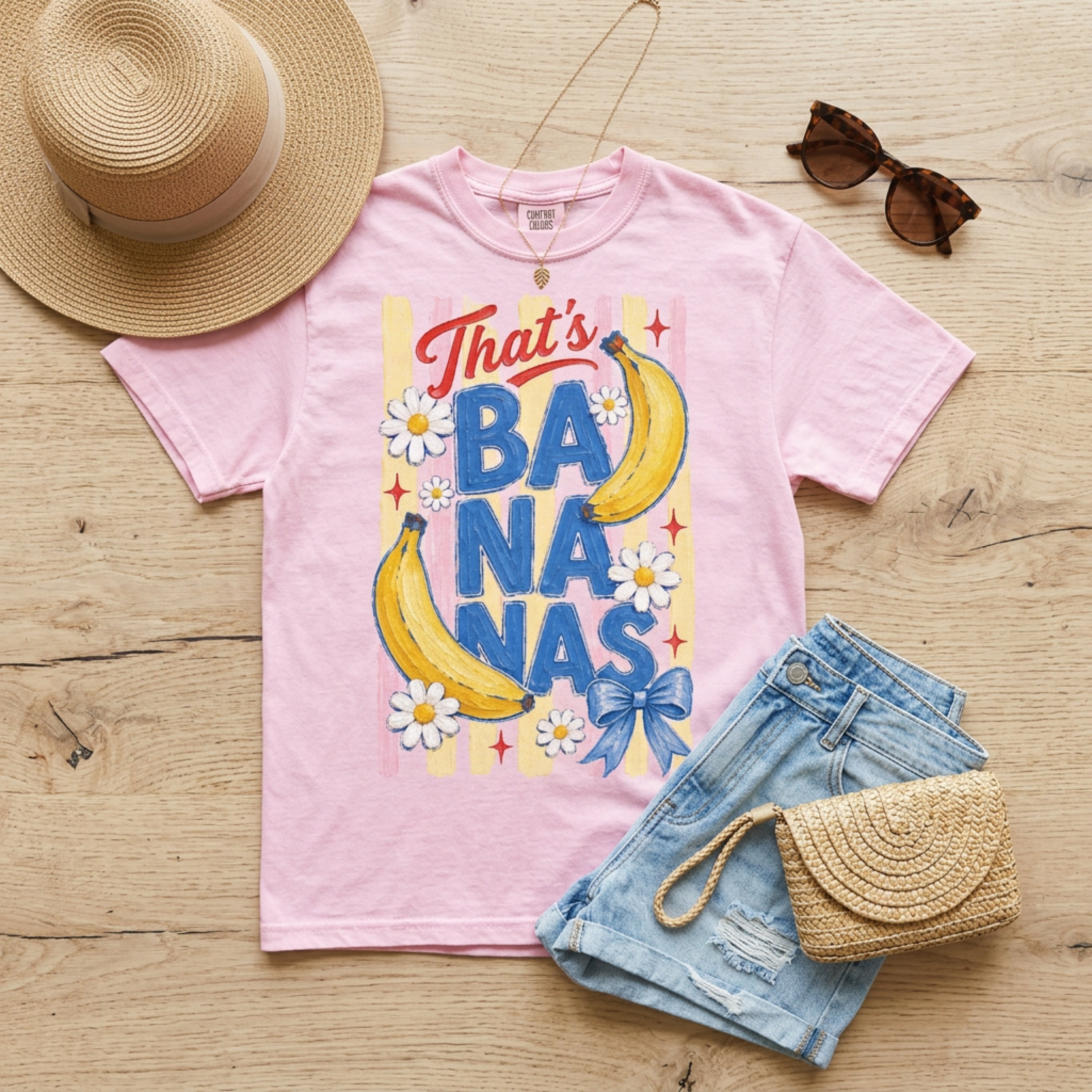 Pink t-shirt with "That's Bananas" text and banana graphic.
