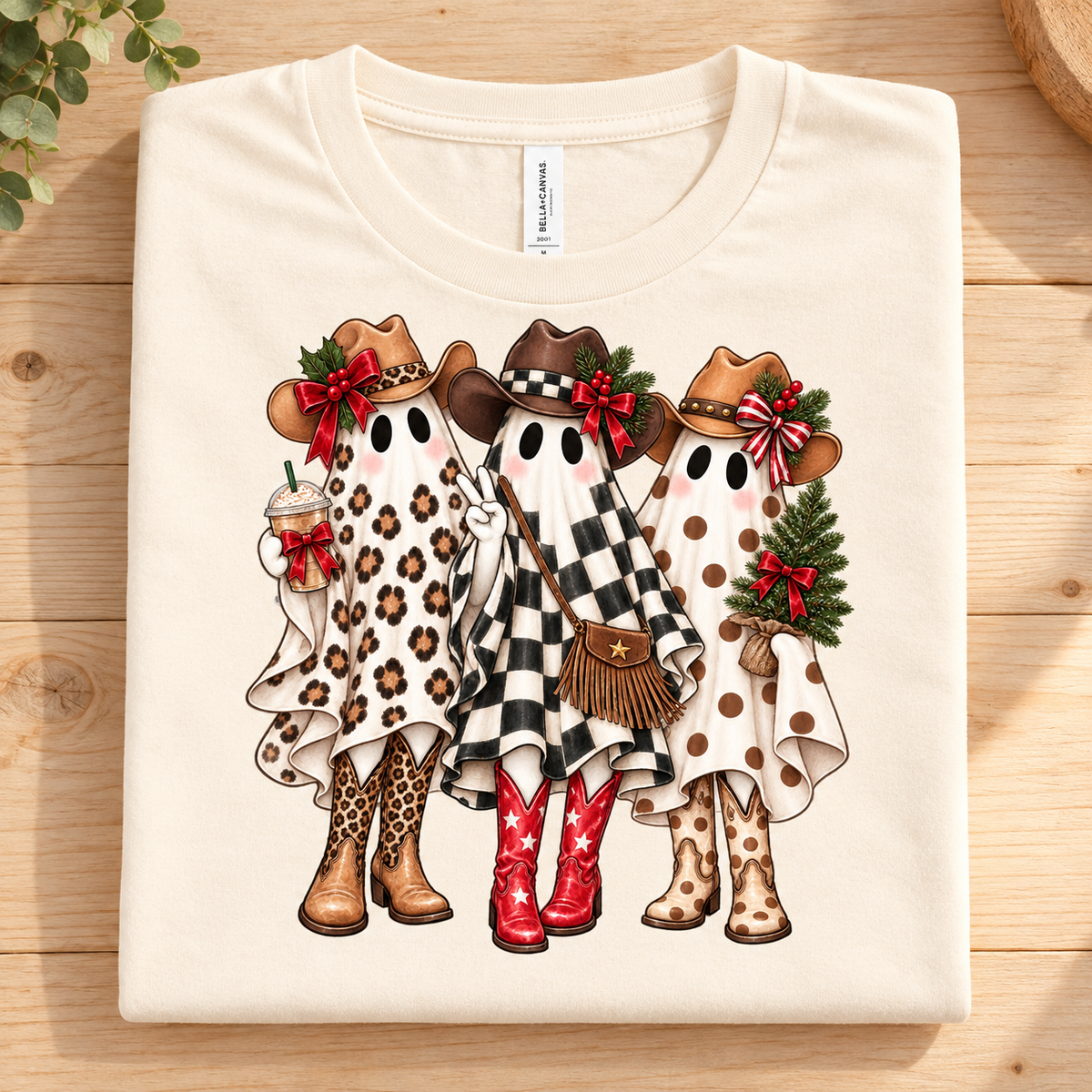 T-shirt with three ghosts wearing cowboy hats and boots, one holding coffee.
