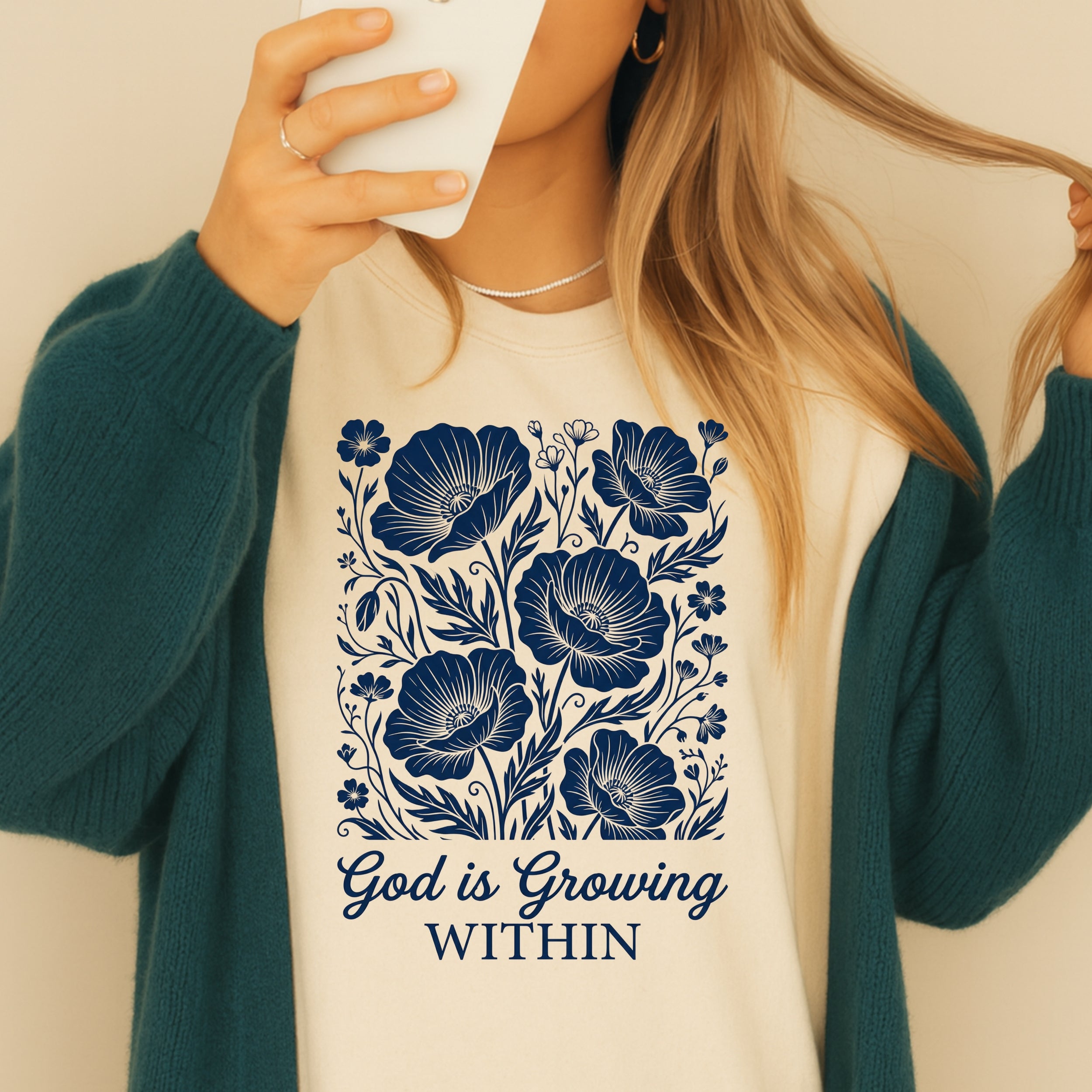T-shirt with navy floral design and text "God is Growing Within".