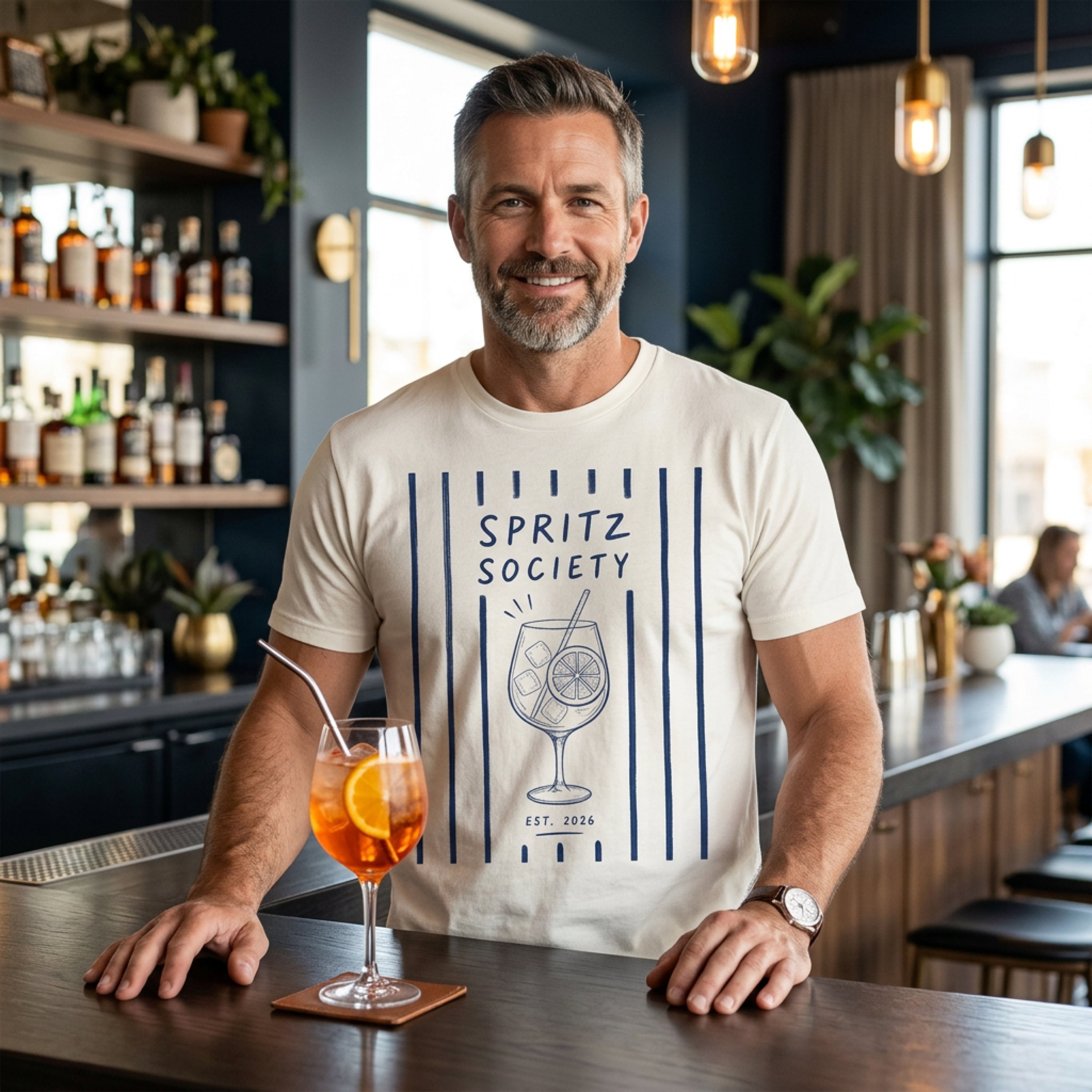 Man in striped t-shirt with spritz graphic and "EST. 2024" text.
