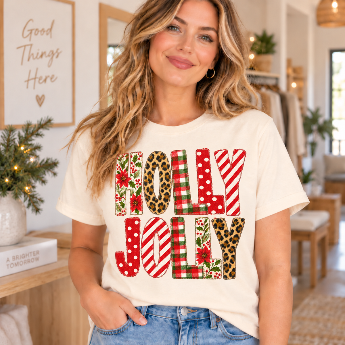 "Holly Jolly" text design on a cream t-shirt with Christmas patterns.