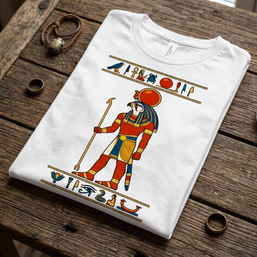 White t-shirt featuring Egyptian god Horus with hieroglyphs and symbols.
