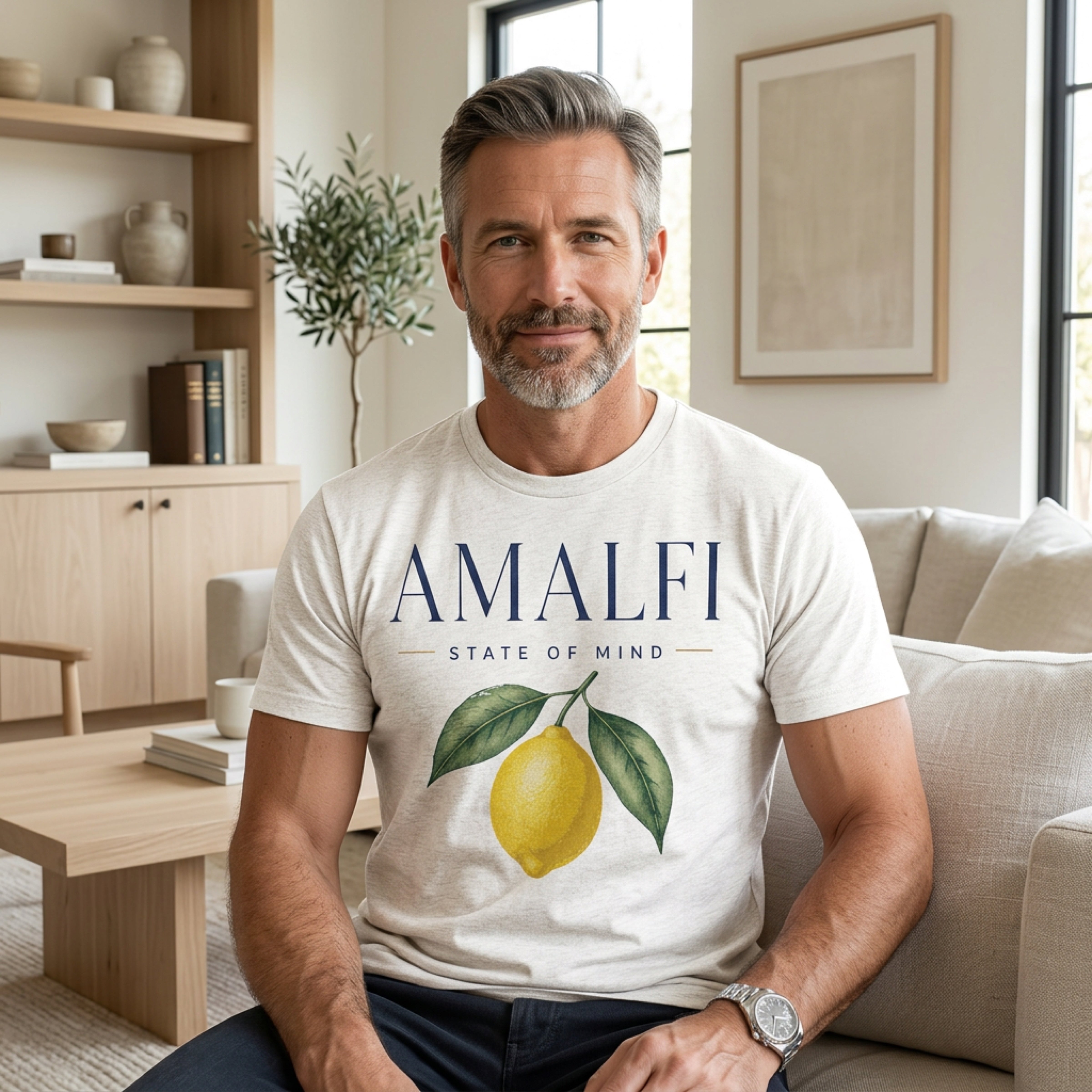 Man wearing a cream t-shirt with "Amalfi State of Mind" text and lemon graphic.