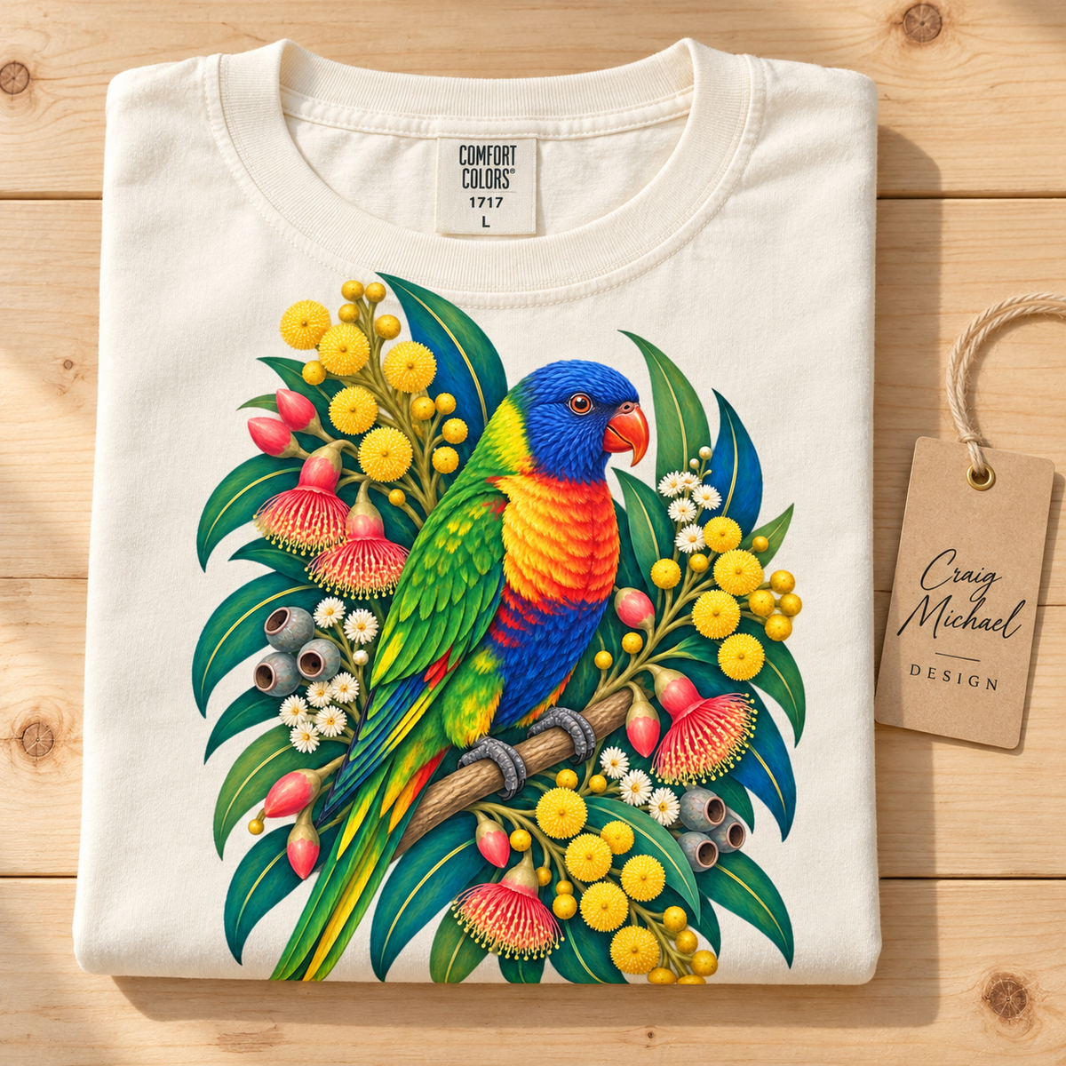 Cream t-shirt with a colorful rainbow lorikeet perched among Australian flora.