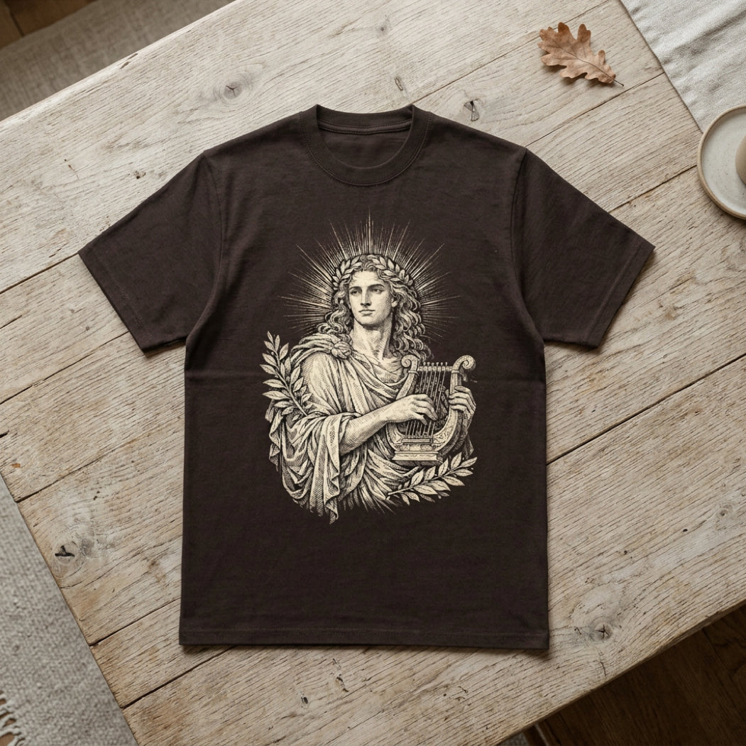 Dark t-shirt with line art of Apollo holding a lyre.