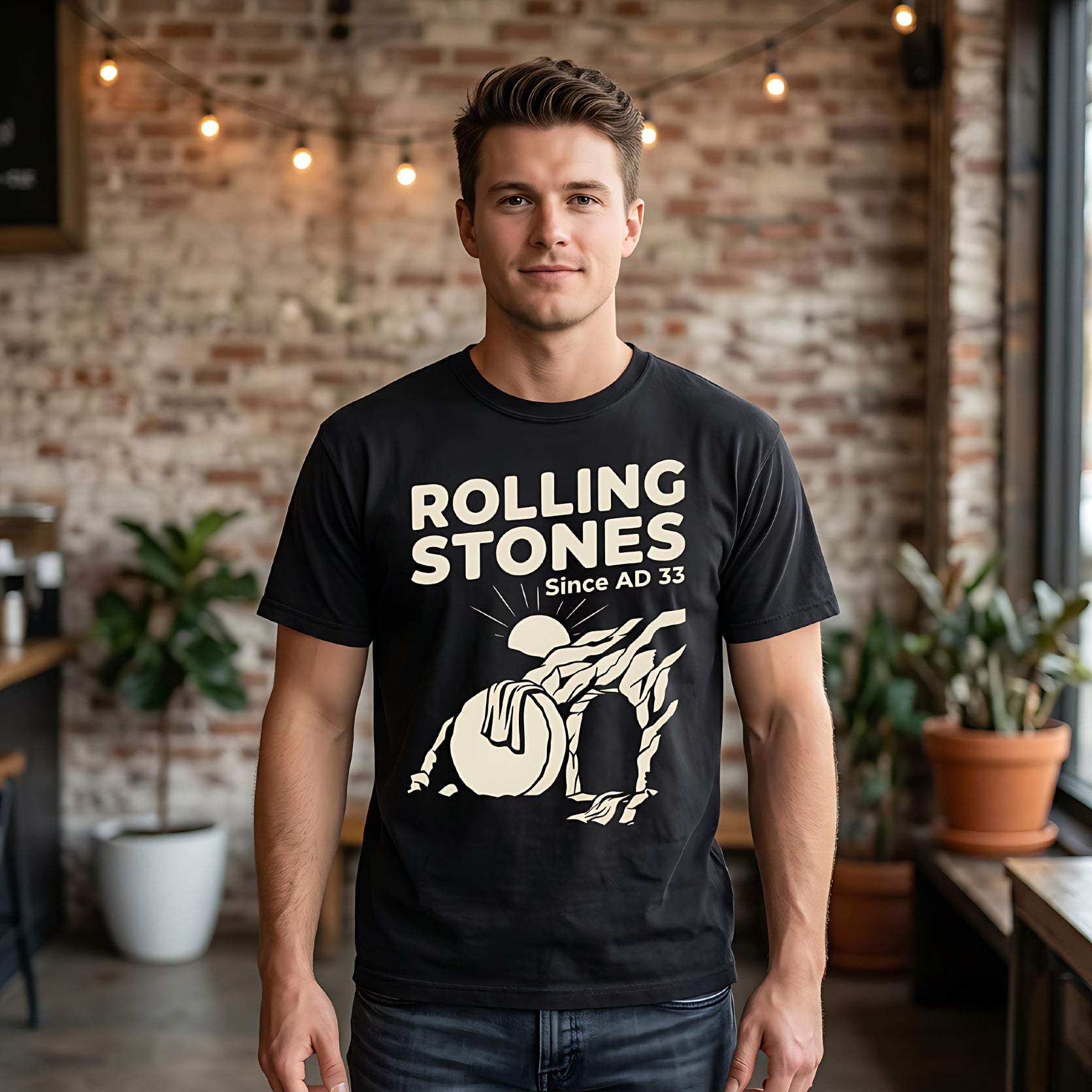 Black Rolling Stones t-shirt with sun and mountain graphic, "Since AD 33".