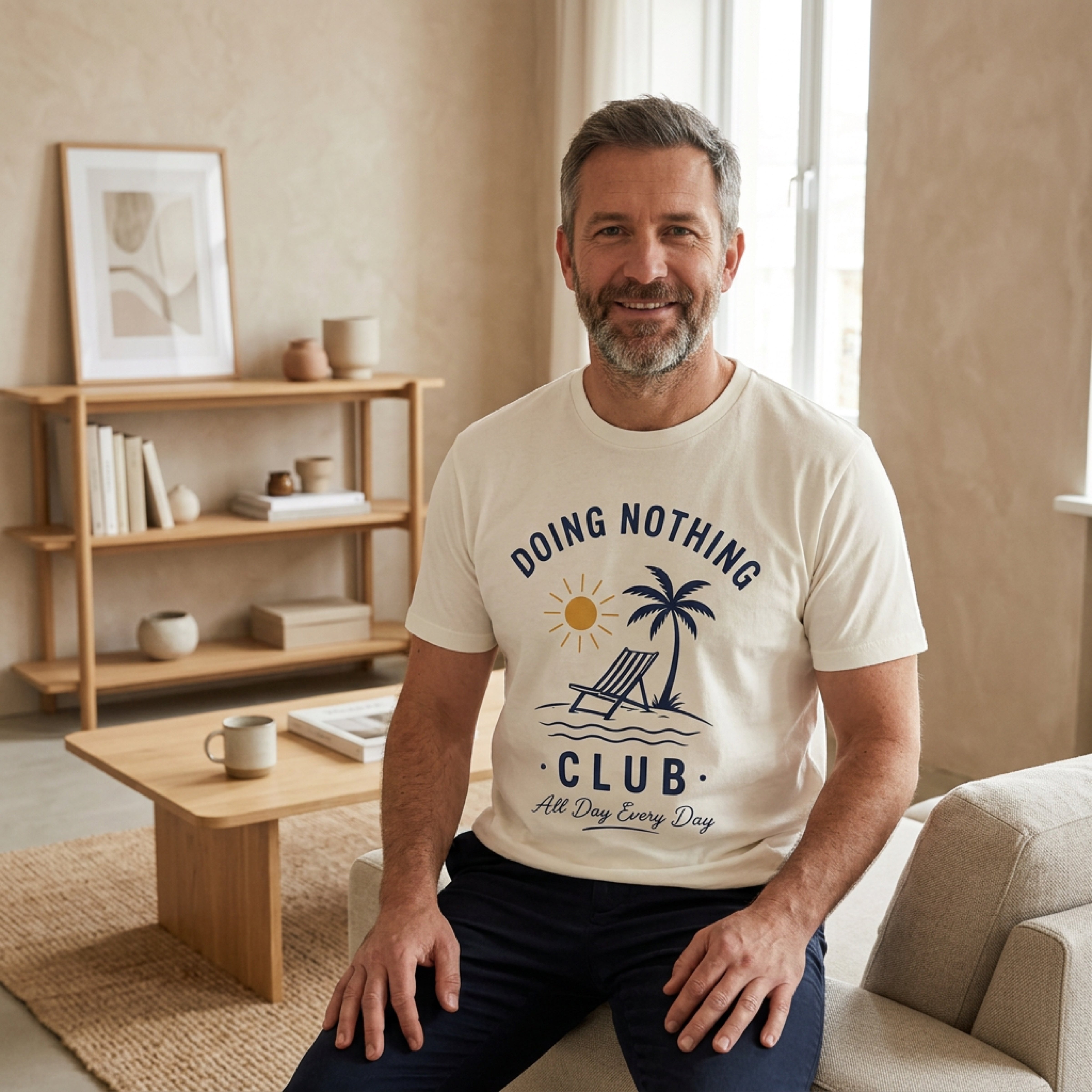 Man wearing a t-shirt that says "DOING NOTHING CLUB All Day Every Day".