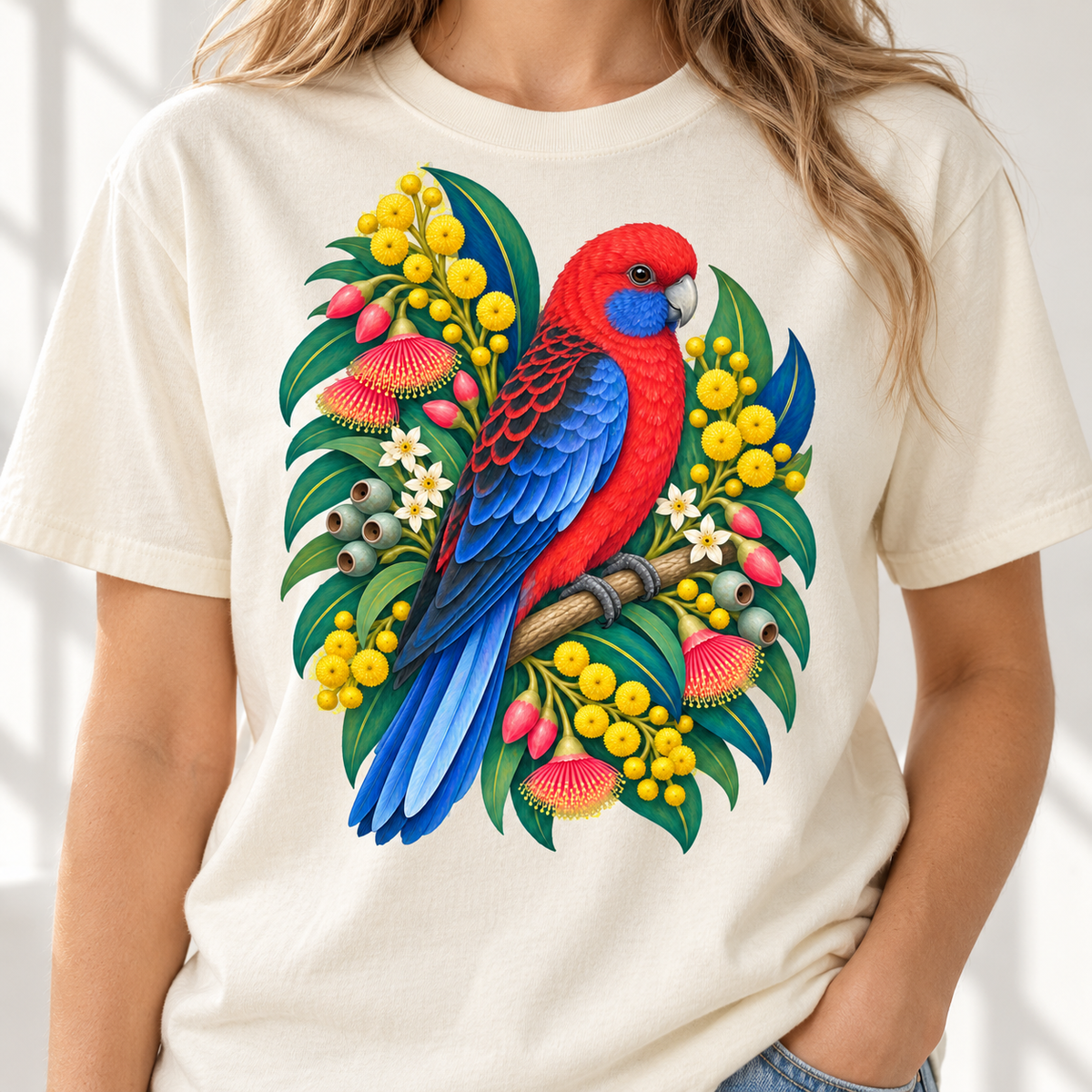 Crimson rosella parrot perched among vibrant Australian flora on a cream t-shirt.