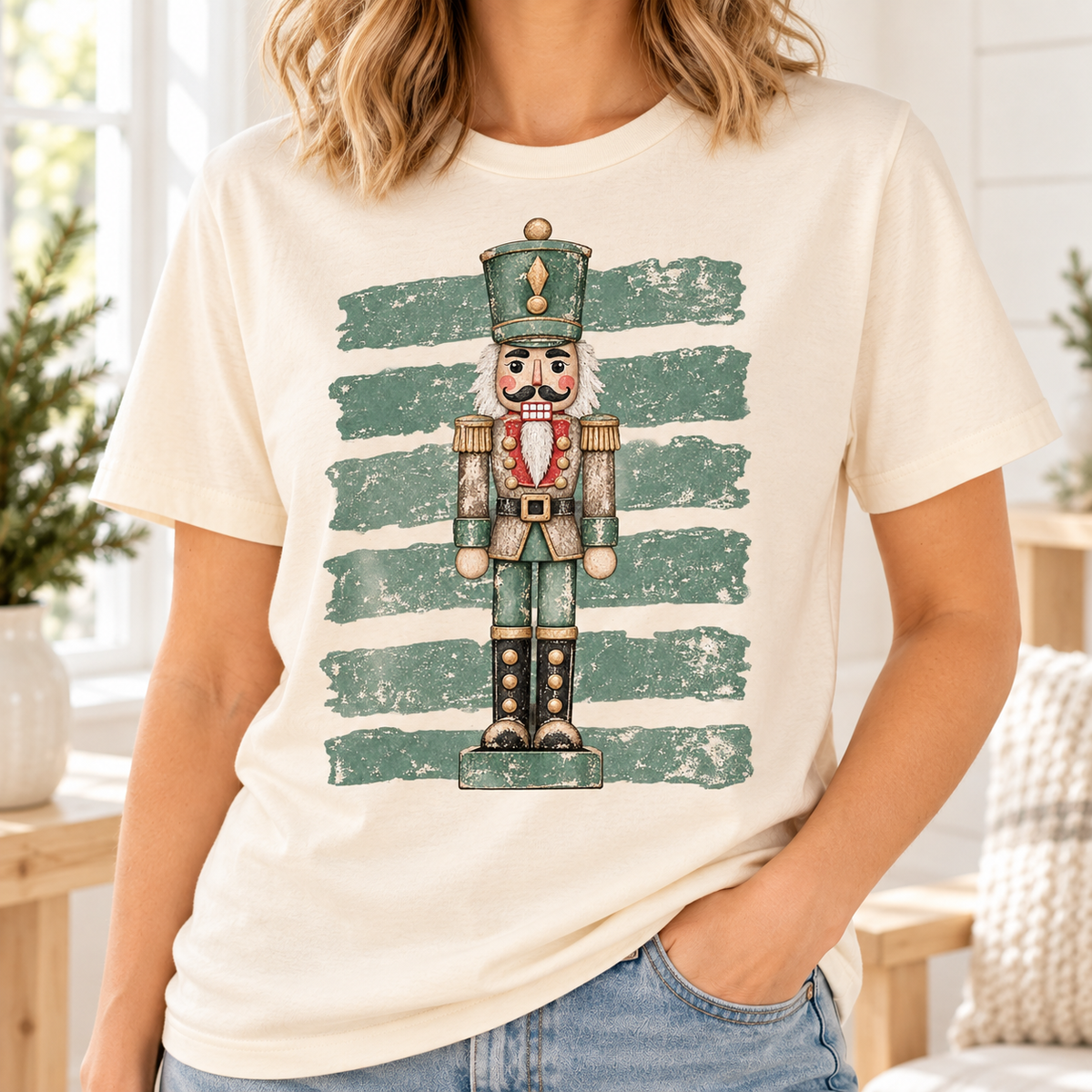 Cream t-shirt with distressed green stripes and a vintage nutcracker graphic.