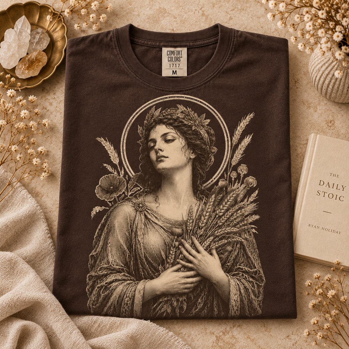 Dark brown Comfort Colors t-shirt with classical artwork of a woman holding wheat.