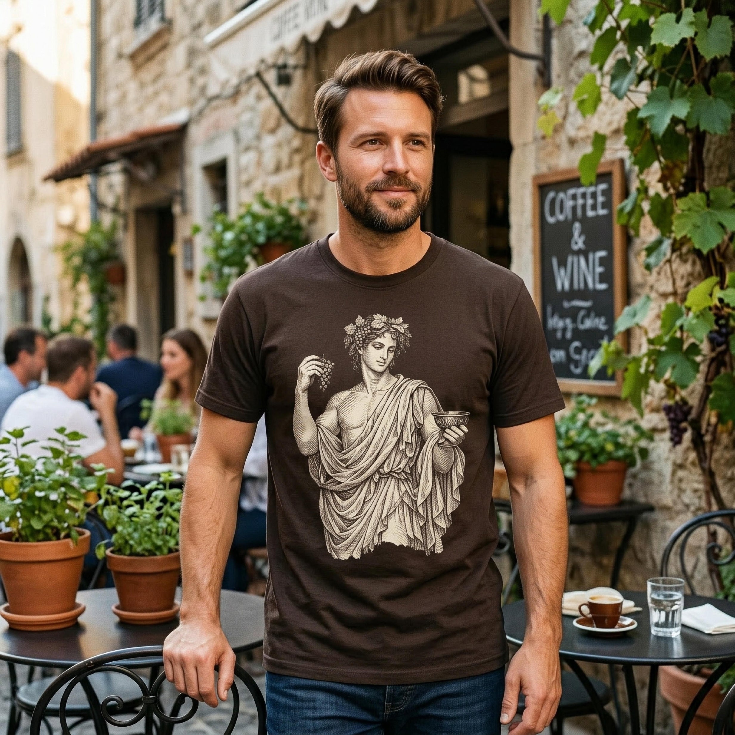 Man wearing brown t-shirt with ancient Greek illustration of Bacchus, outdoors.