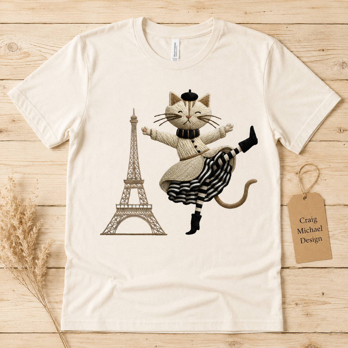 Cat in beret and striped skirt dances by Eiffel Tower, "Craig Michael Design" tag.