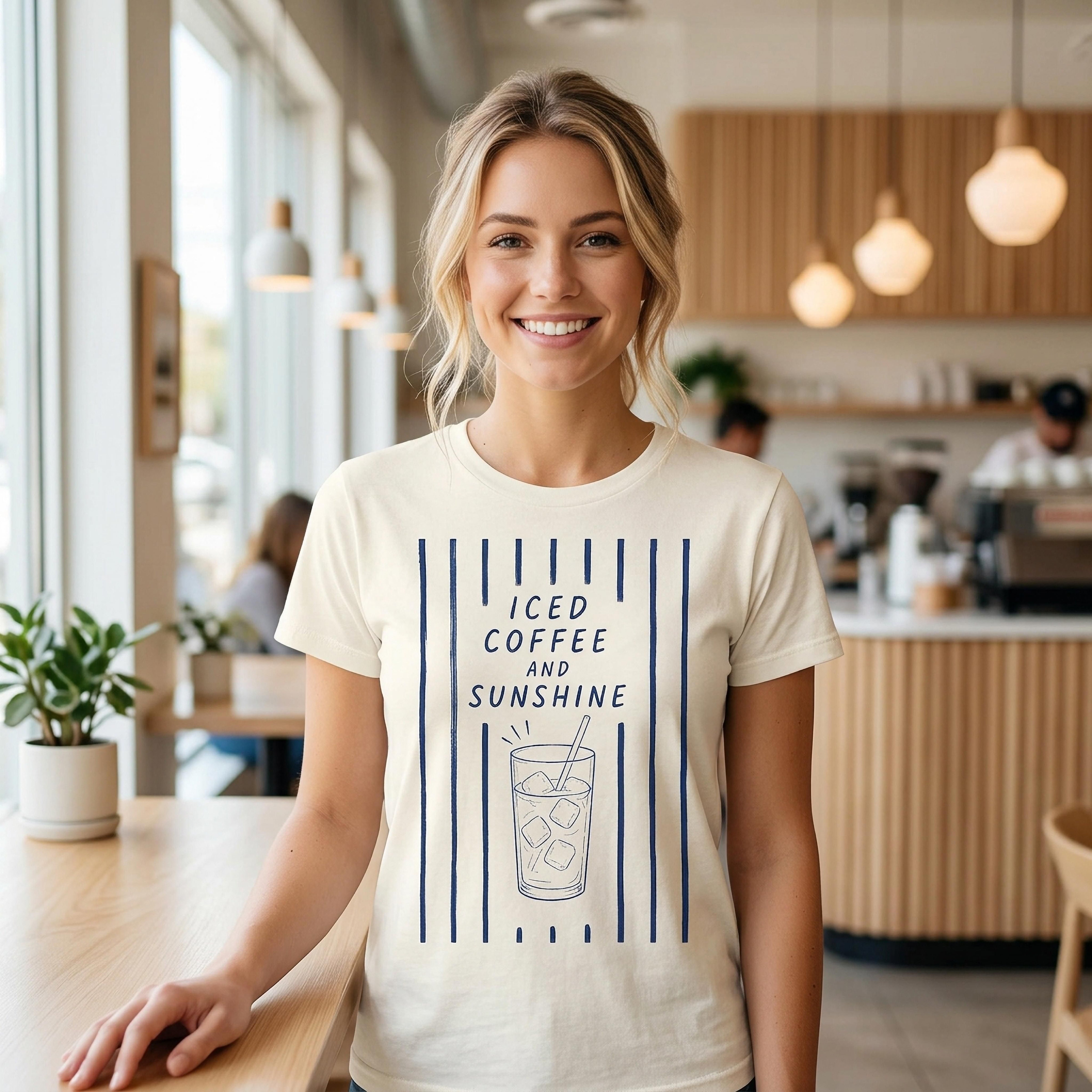 Woman wearing cream t-shirt with "Iced Coffee and Sunshine" text and ice cube graphic.