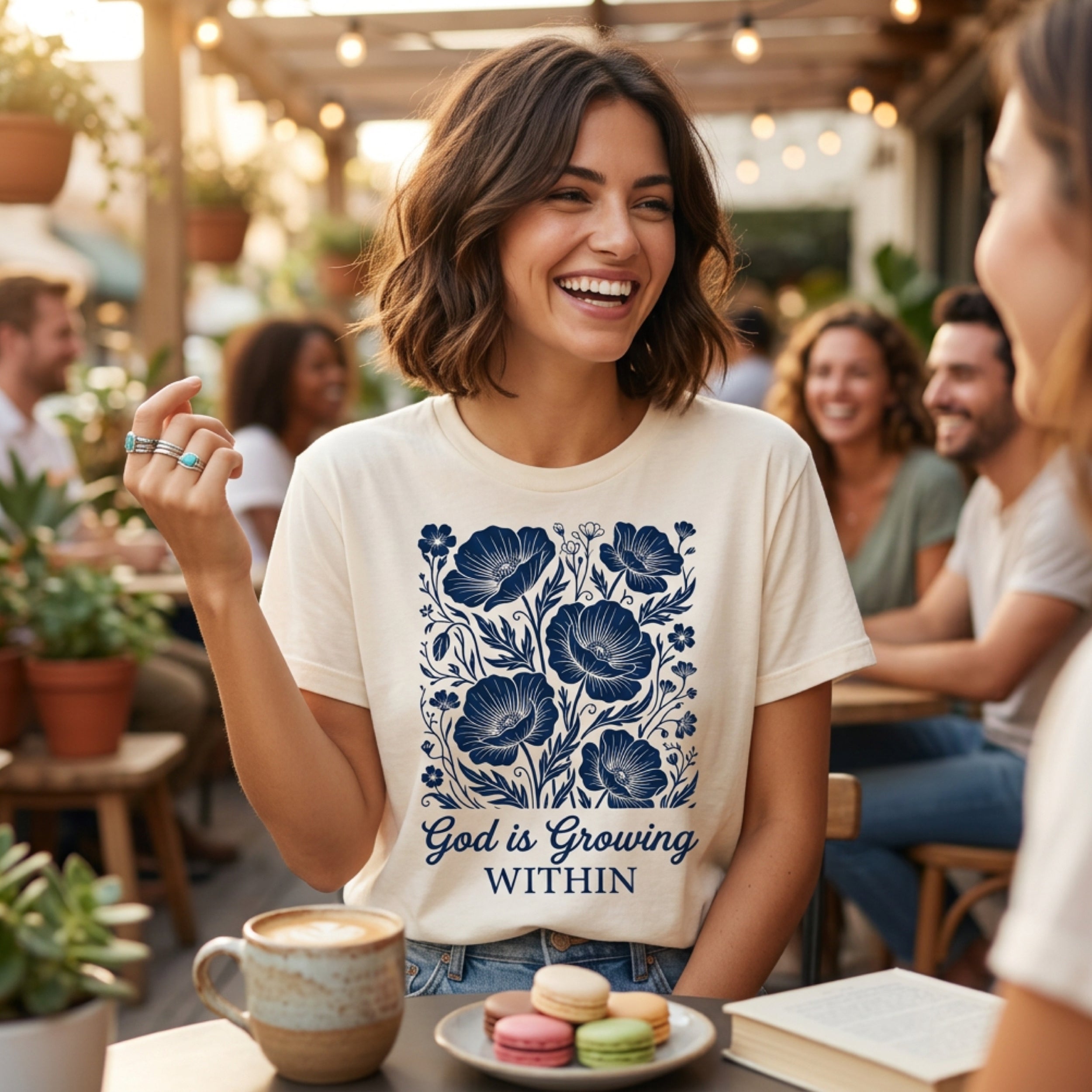 Cream t-shirt with blue floral design and "God is Growing Within" text.