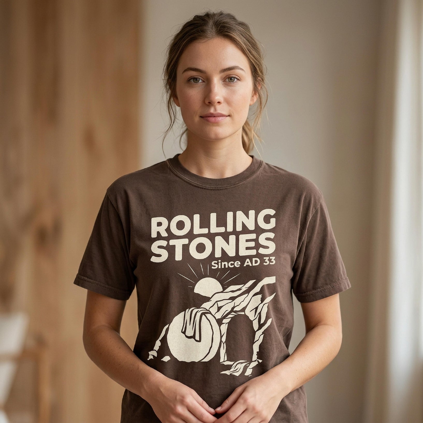 Brown t-shirt with "Rolling Stones Since AD 33" and a stylized sun graphic.