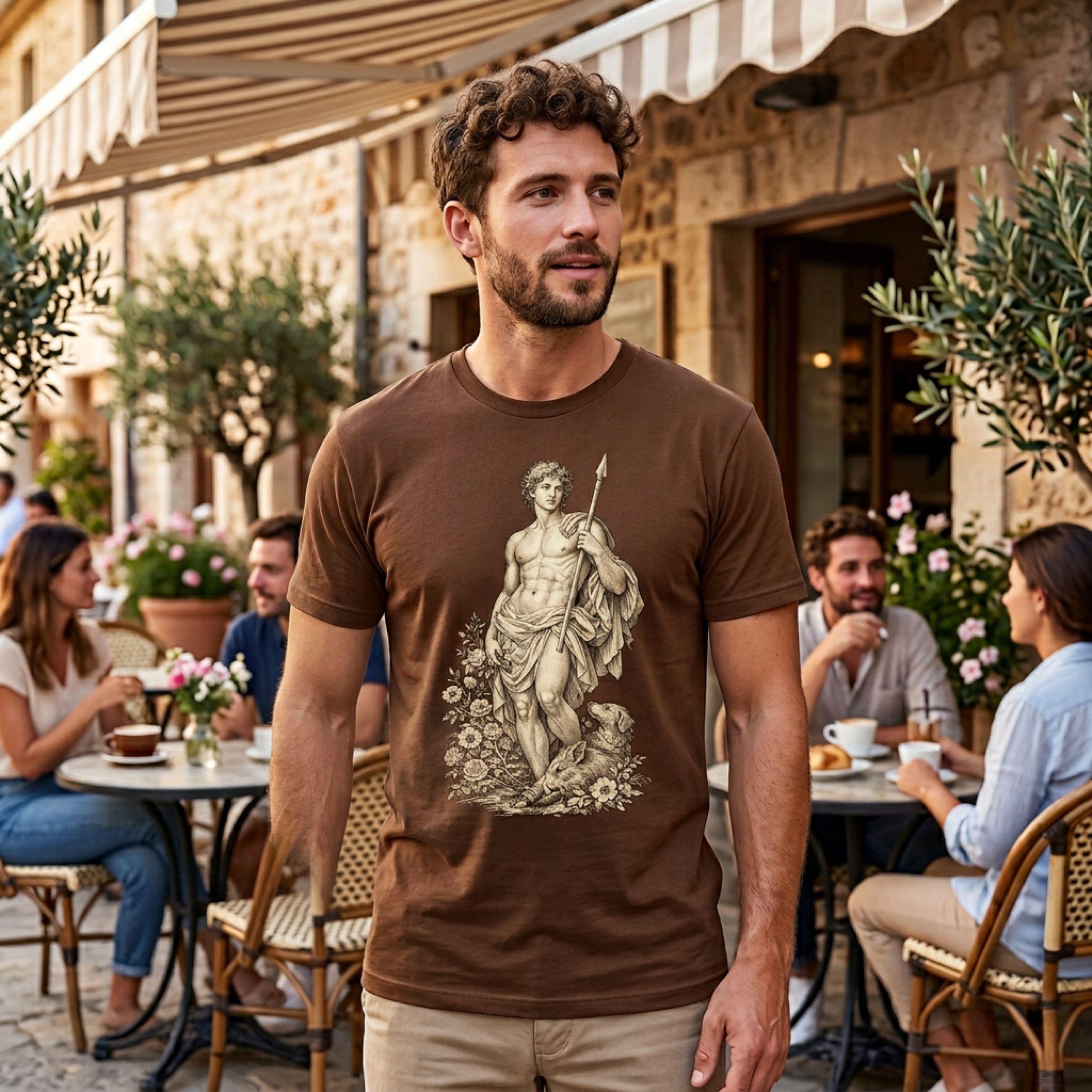 Man wearing brown t-shirt with a drawing of a classical figure and dog.