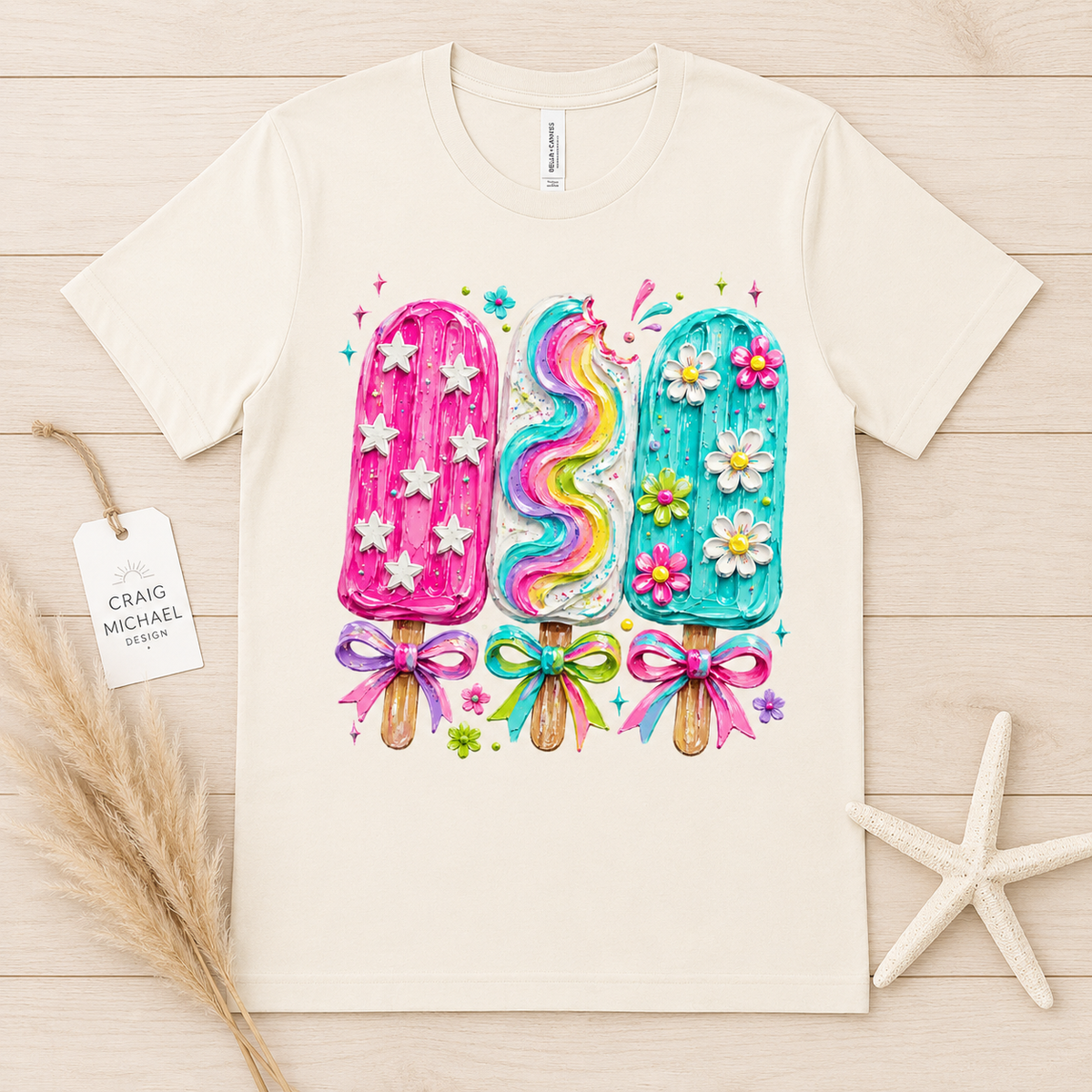 Three popsicles: pink with stars, rainbow swirl, and blue with flowers.