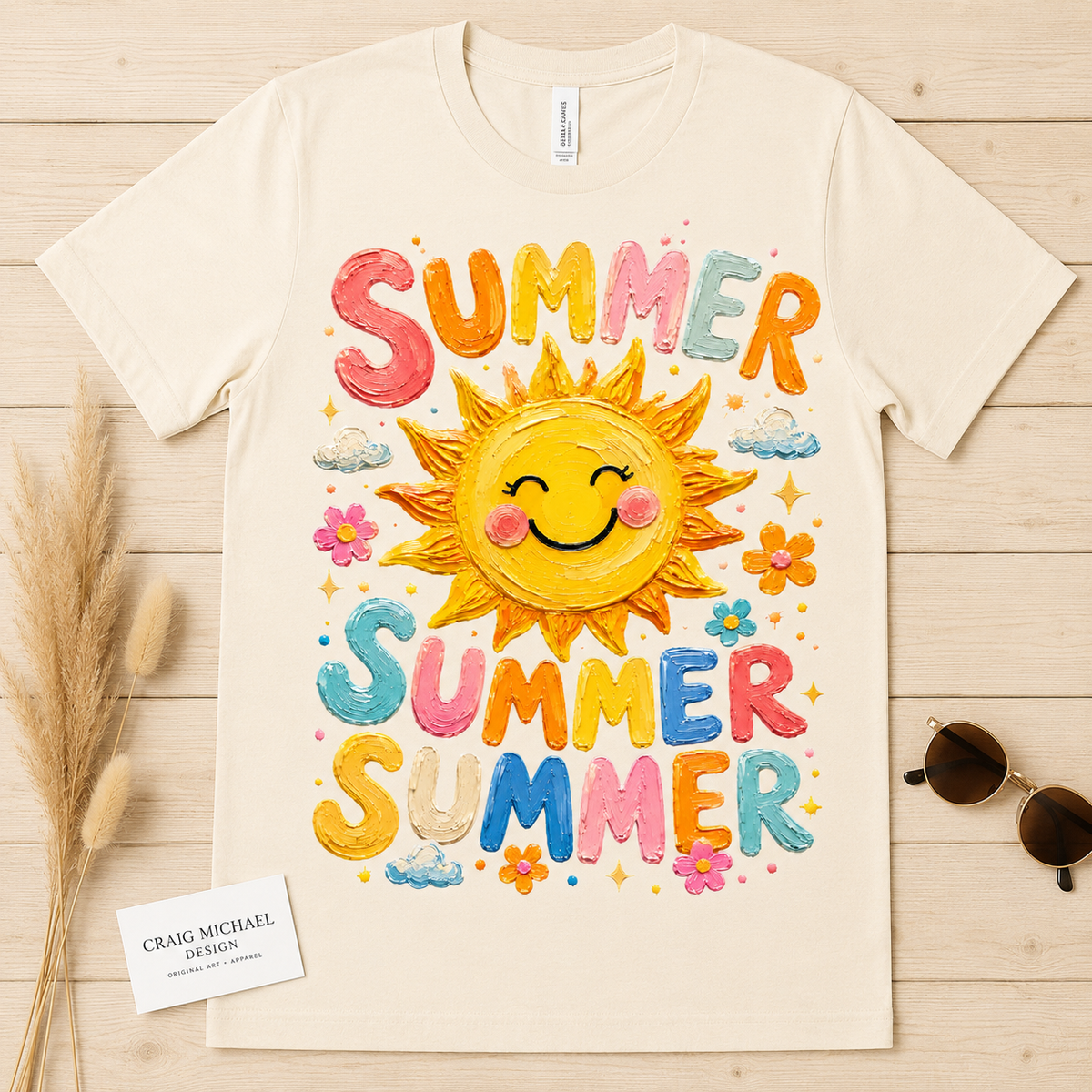 Cream t-shirt with a smiling sun and "SUMMER SUMMER" text in colorful, textured letters.