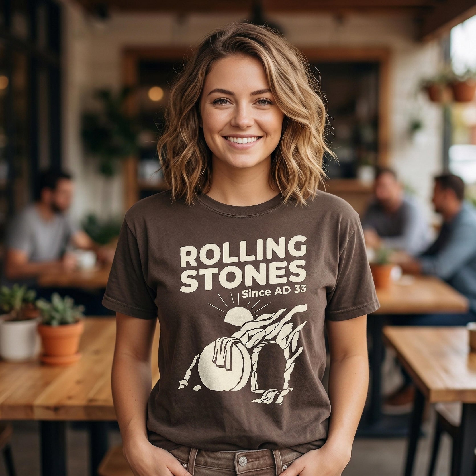Brown t-shirt with "Rolling Stones Since AD 33" and a graphic.