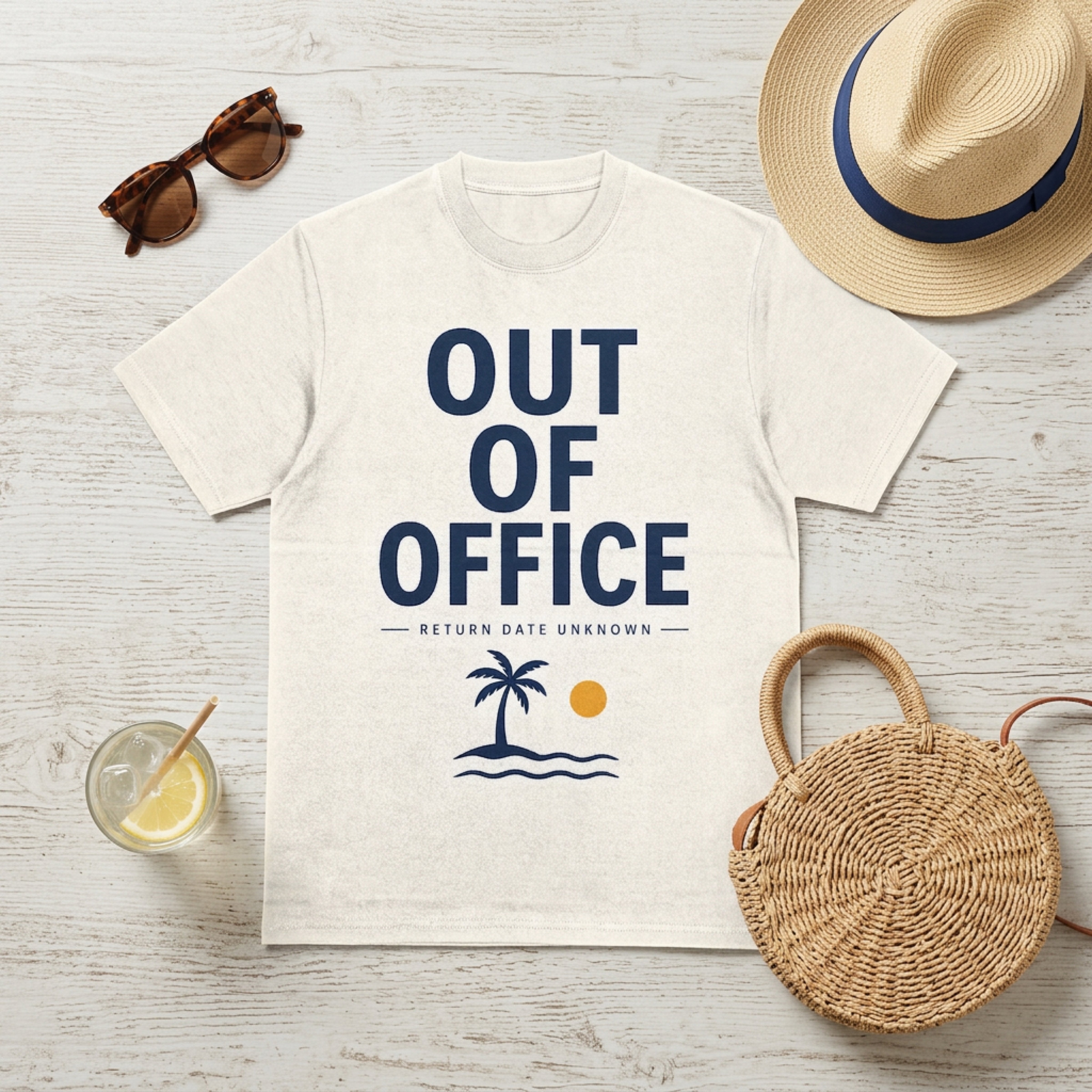 "Out of Office" graphic tee with palm tree and sun, on a light-colored t-shirt.