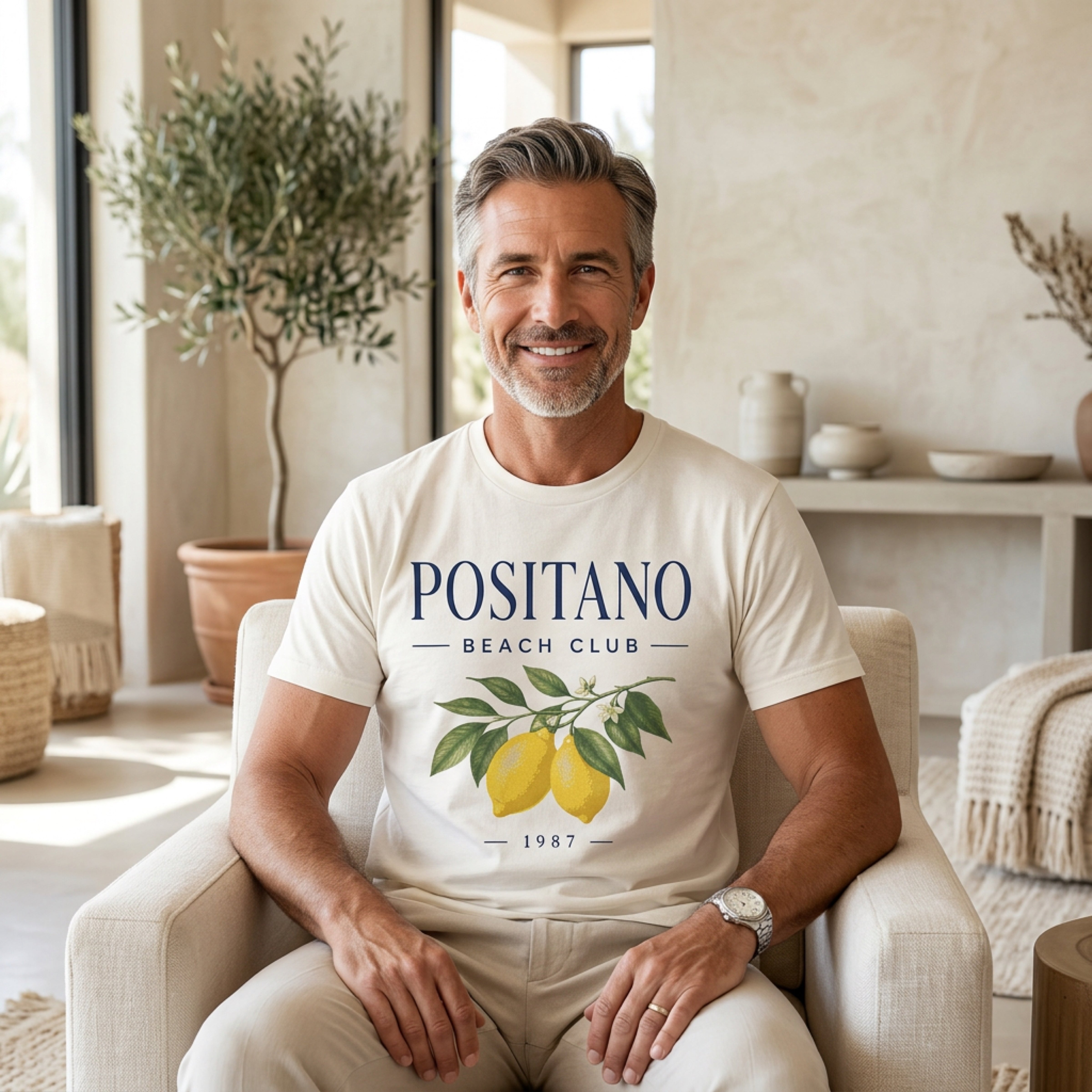 Man in cream t-shirt with "Positano Beach Club" and lemons.