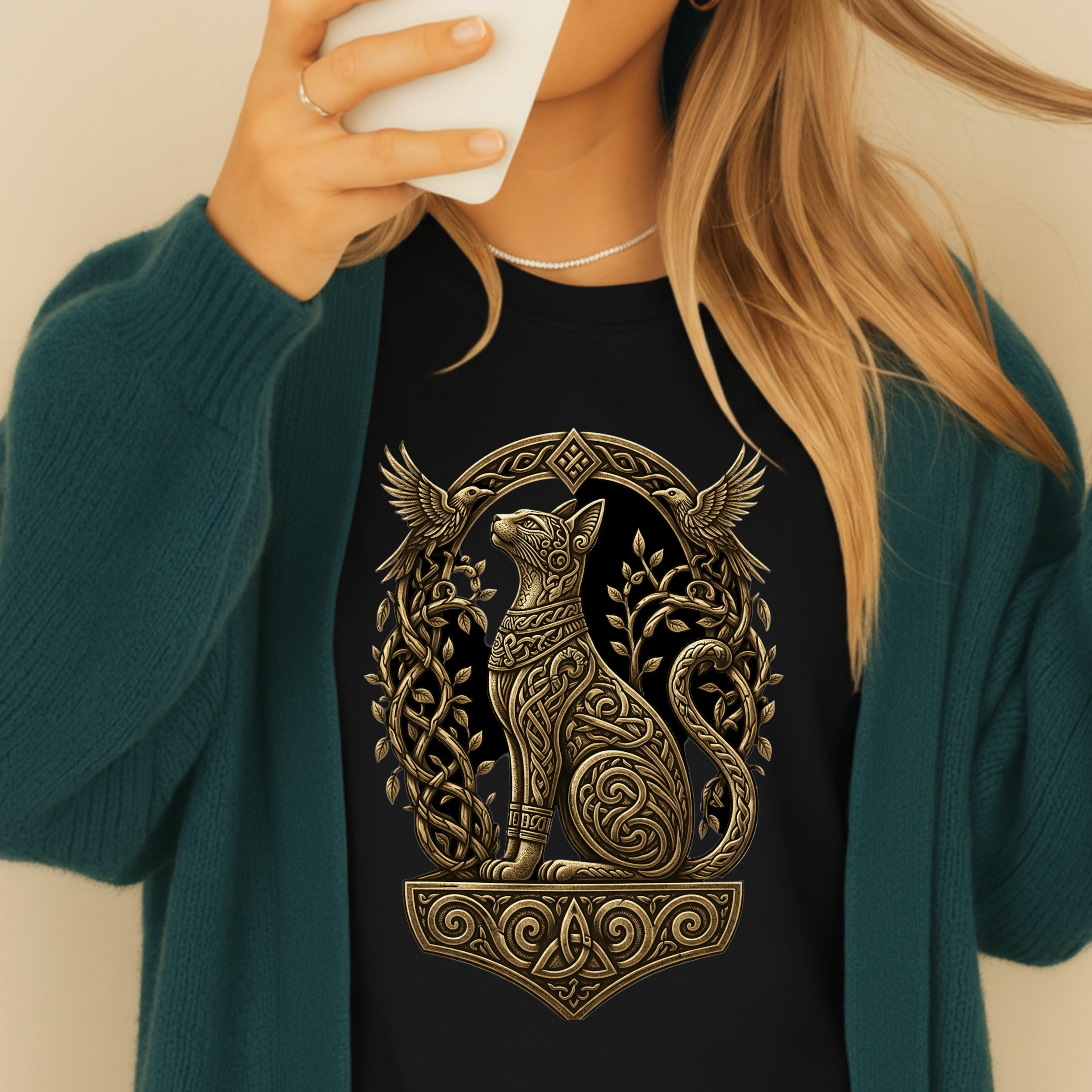 Black t-shirt with a Celtic knotwork cat design and birds.