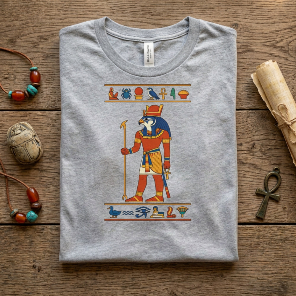 Grey t-shirt with Egyptian god Horus graphic and hieroglyphs.